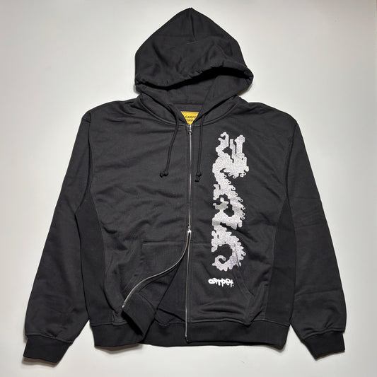 Front image of black zip hoodie with silver art printed on left side.