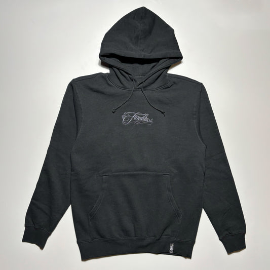 Front image of black hoodie with embroidery on chest.
