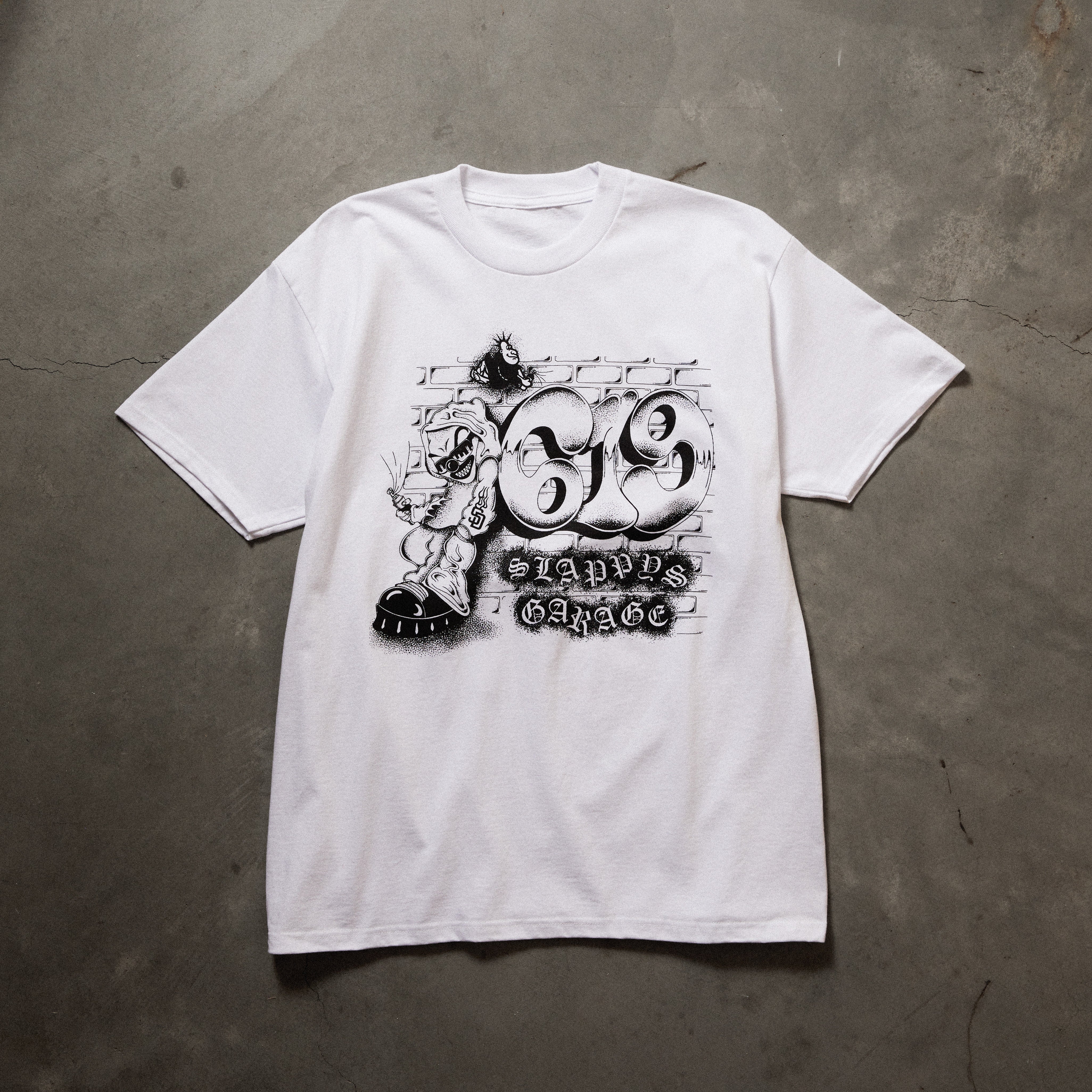 Full front image of white tee with printed art on chest