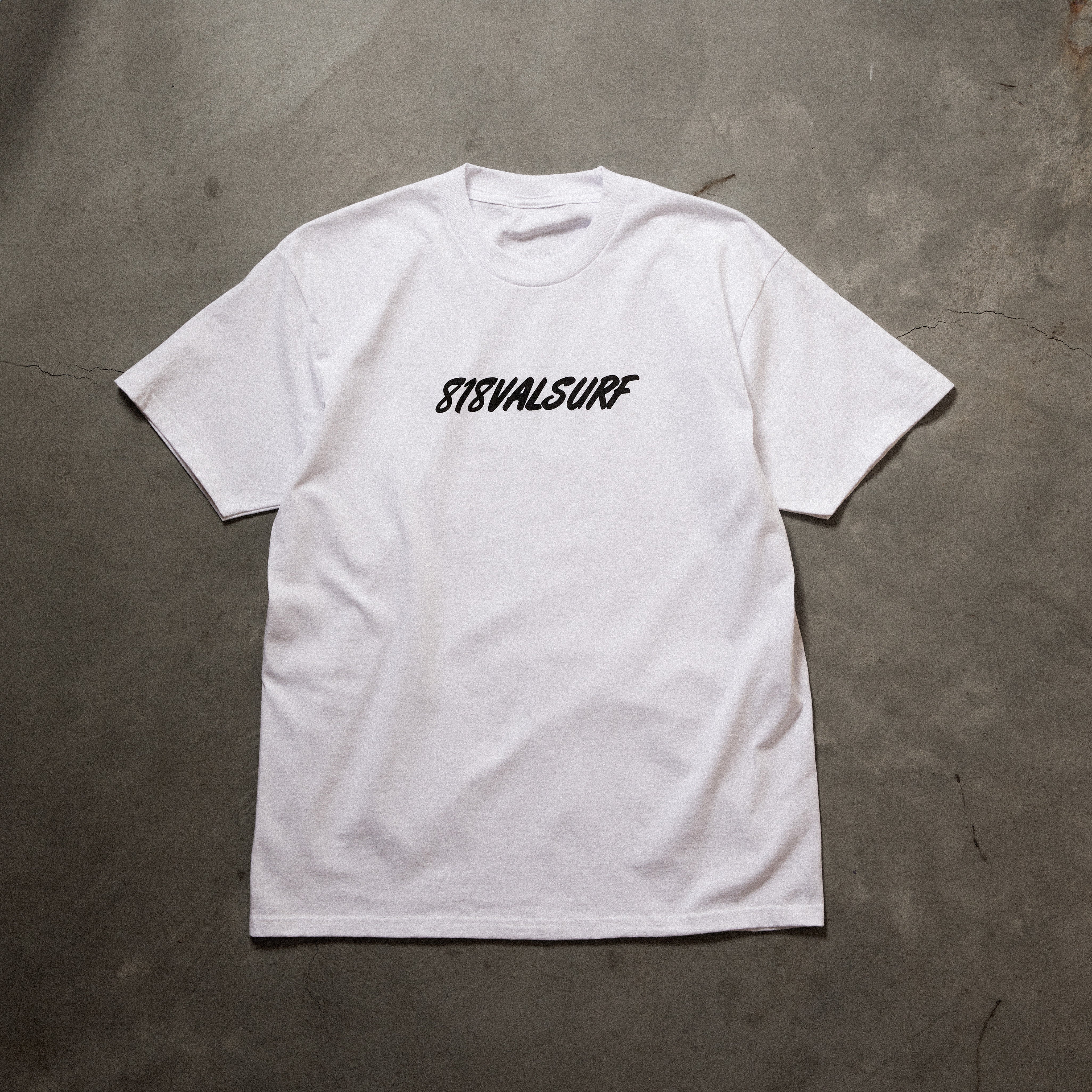 Full front image of white tee with black 818 val surf font in black printed on chest