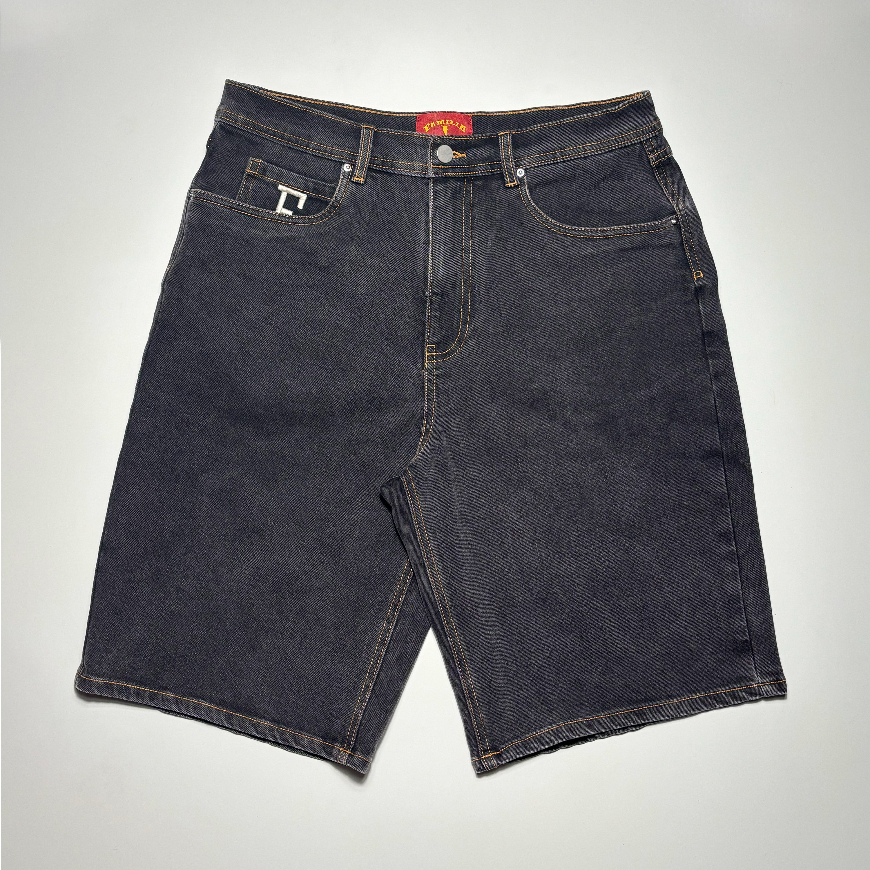 Full image of black rinse cotton denim shorts. Gold contrast stitch and custom woven label.