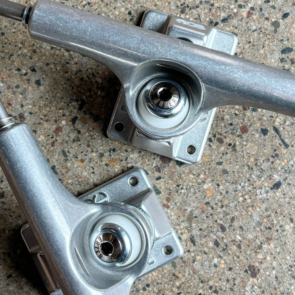 Close detail of inverted kingpin and hanger details.