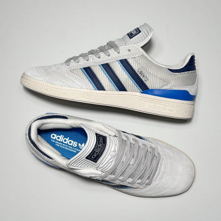 Toe down view with side profile.
Blue heel tab and Busenitz in silver foil font on mid-panel