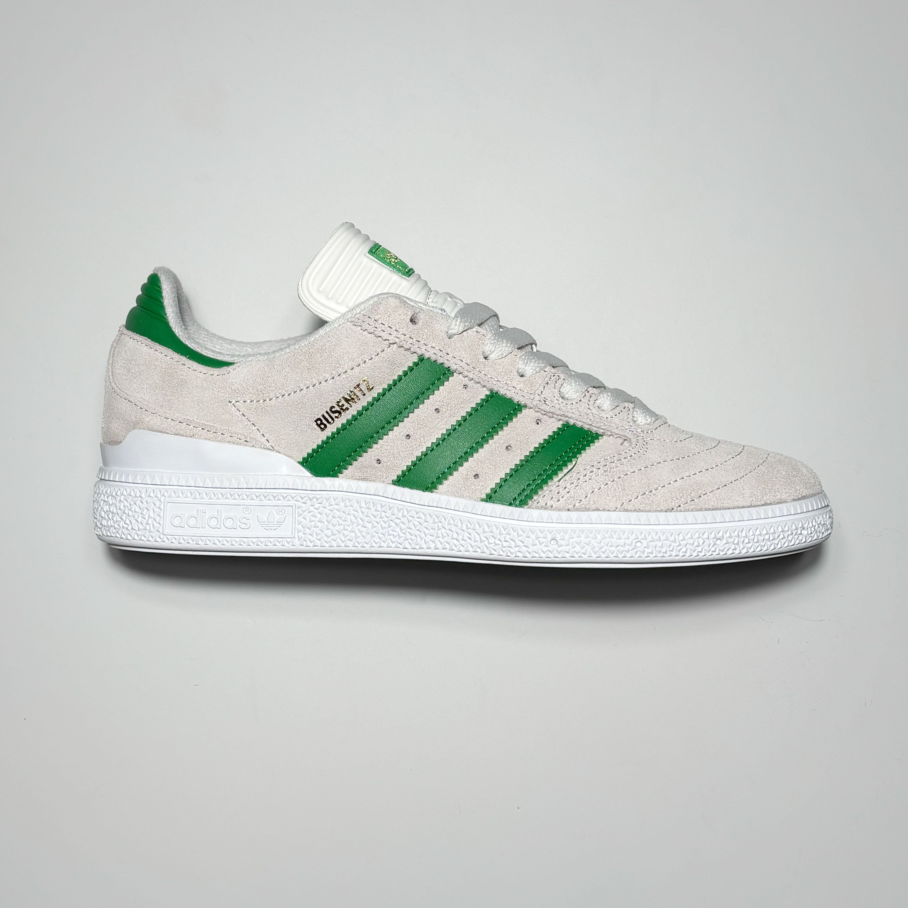 Side profile of right shoe.
White suede with green stripes.