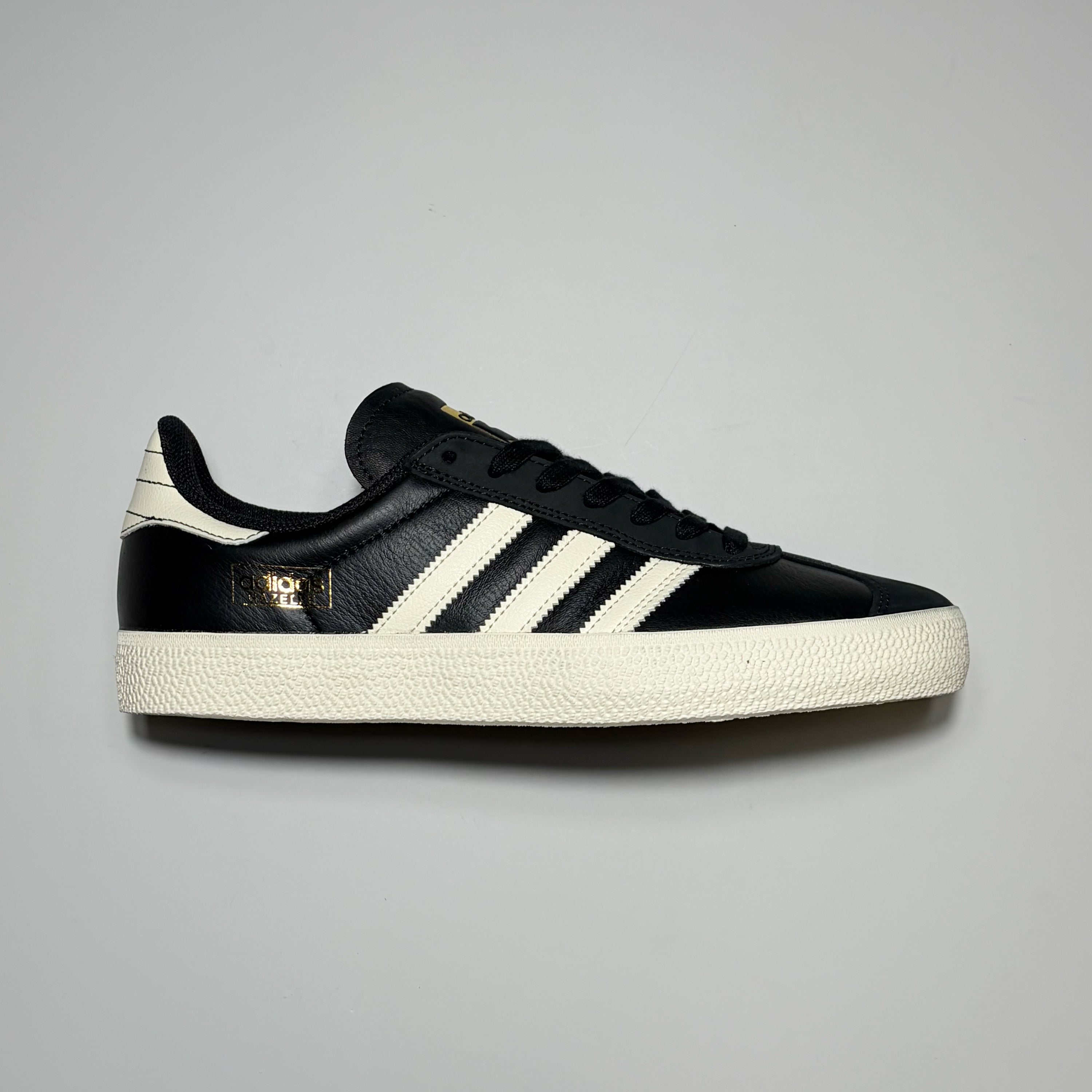 Right side image, Adidas Gazelle ADV in black leather with white stripes.