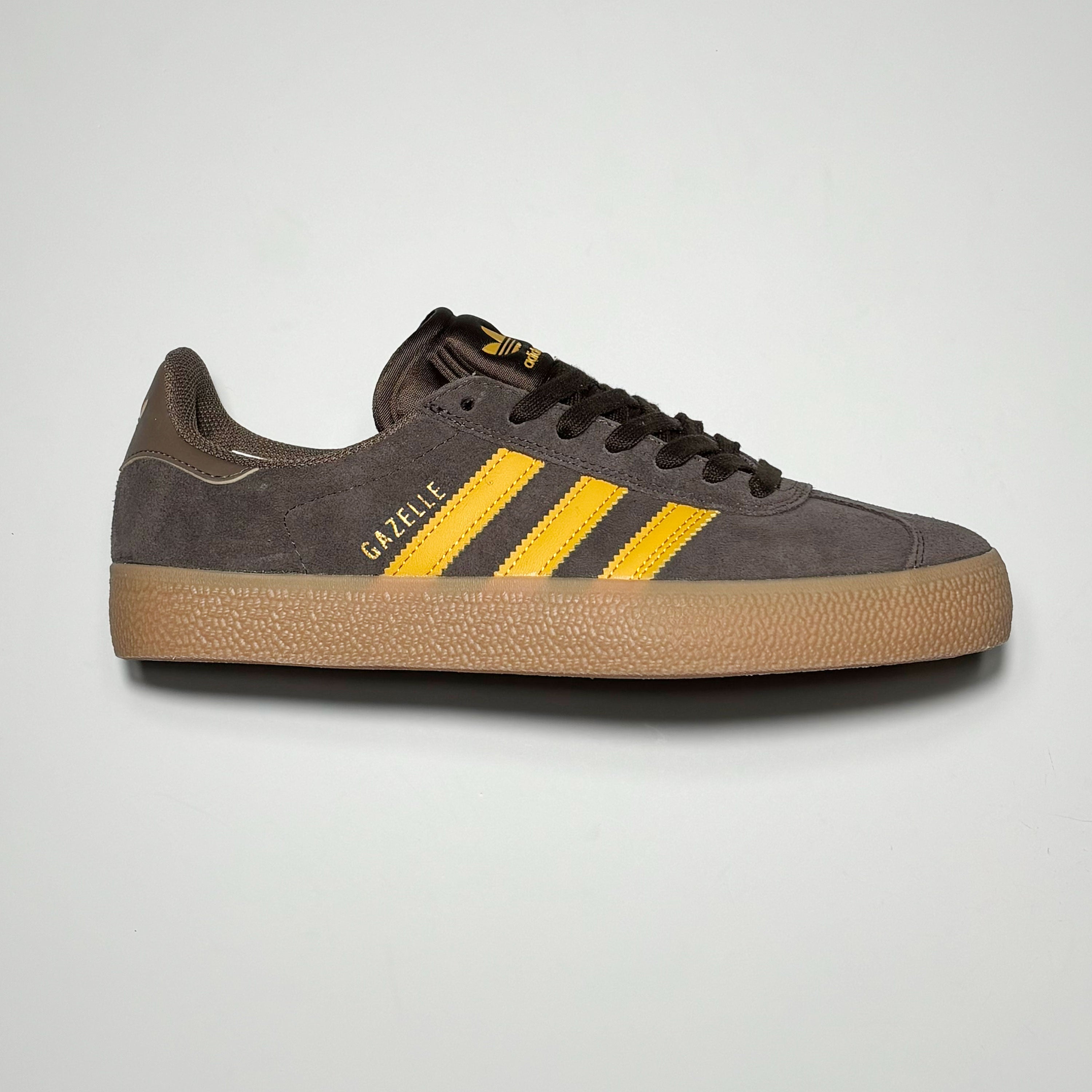 Side profile of right shoe.
Brown suede with yellow stripes and gum outsole.