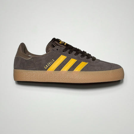 Side profile of right shoe.
Brown suede with yellow stripes and gum outsole.