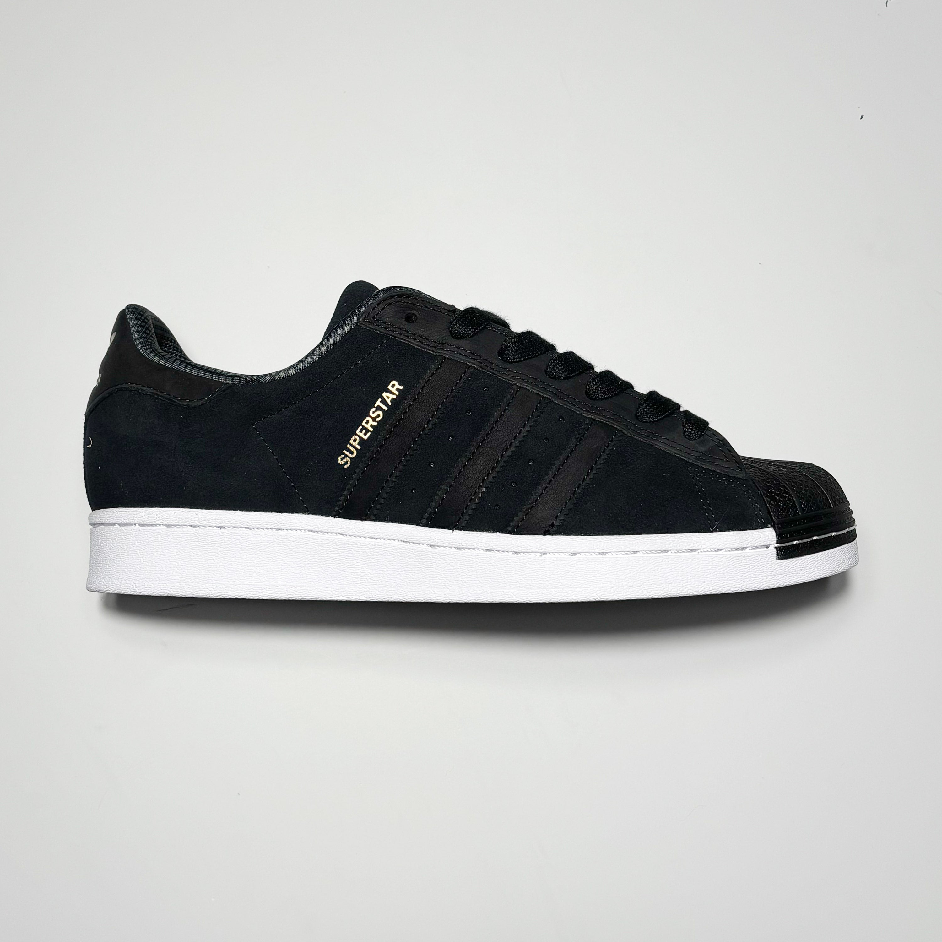 Side image of right shoe.
Black suede with black rubber toe.