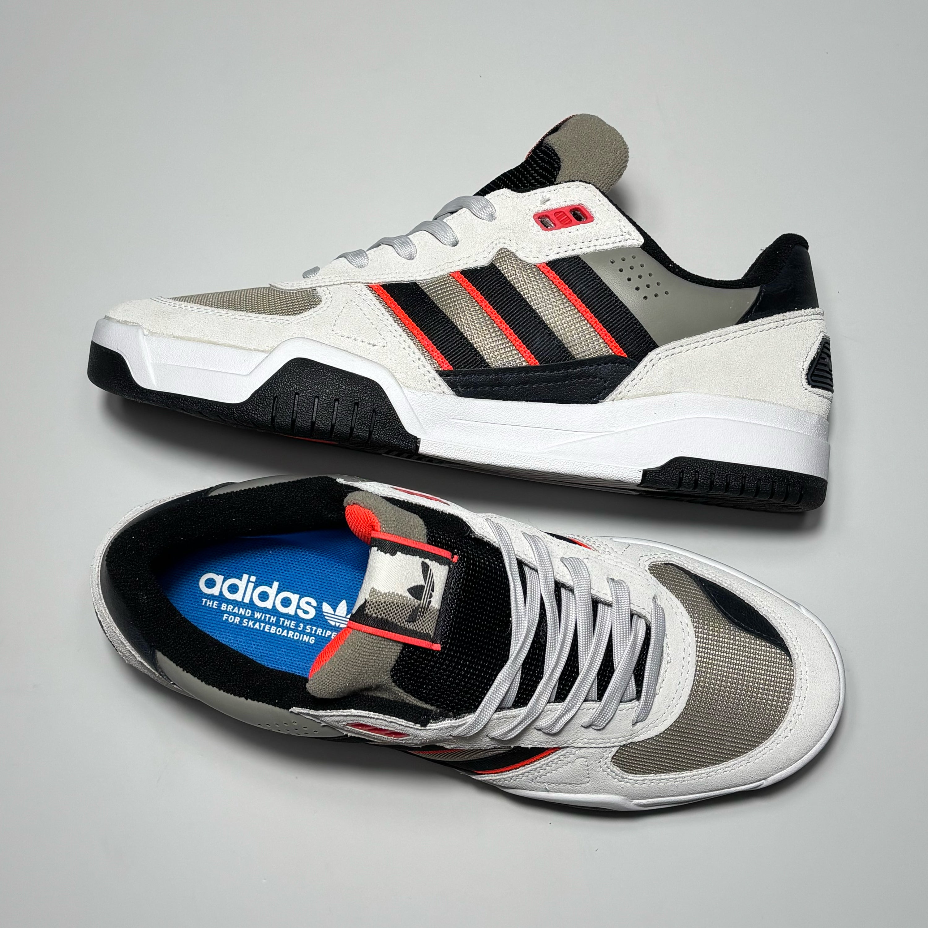 Toe down view with side profile.
Mesh tongue and adidas label.