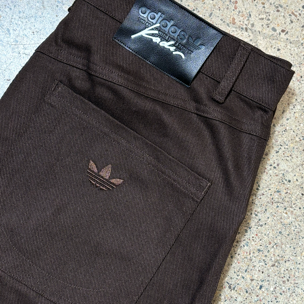 Close detail of embroidered pocket and adidas kader label. 