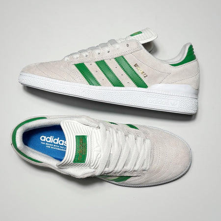 Toe down view with side profile.
Busenitz in gold foil on heel with green adidas tongue badge.