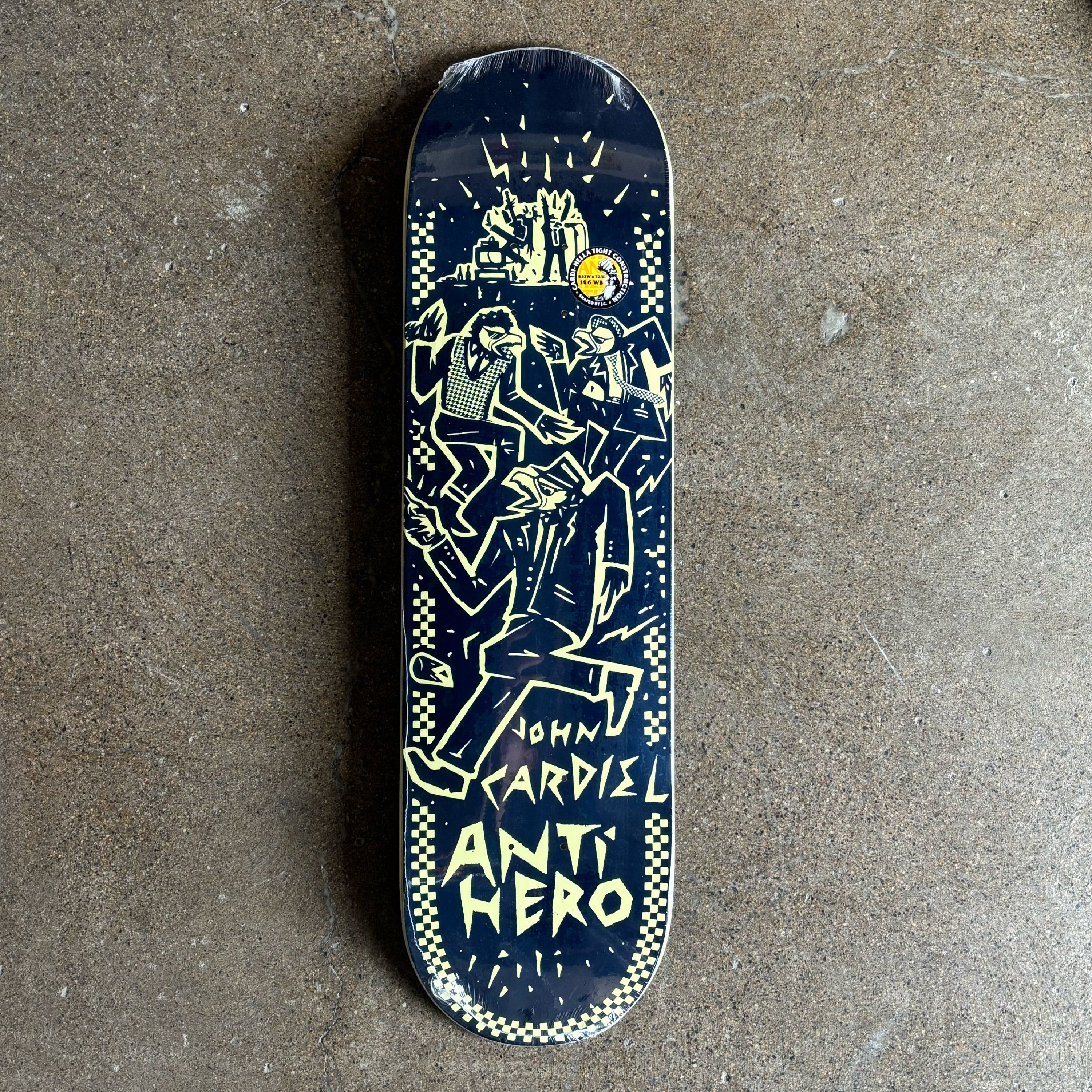 Skateboard deck with graphic design and 'Anti Hero' branding on a concrete surface