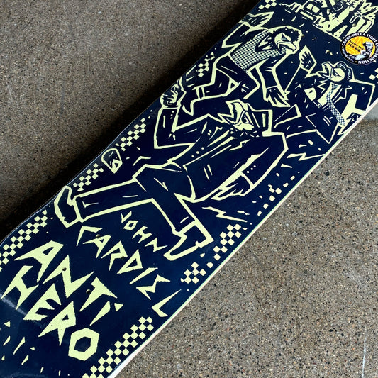 Skateboard deck with graphic design and text on a concrete surface