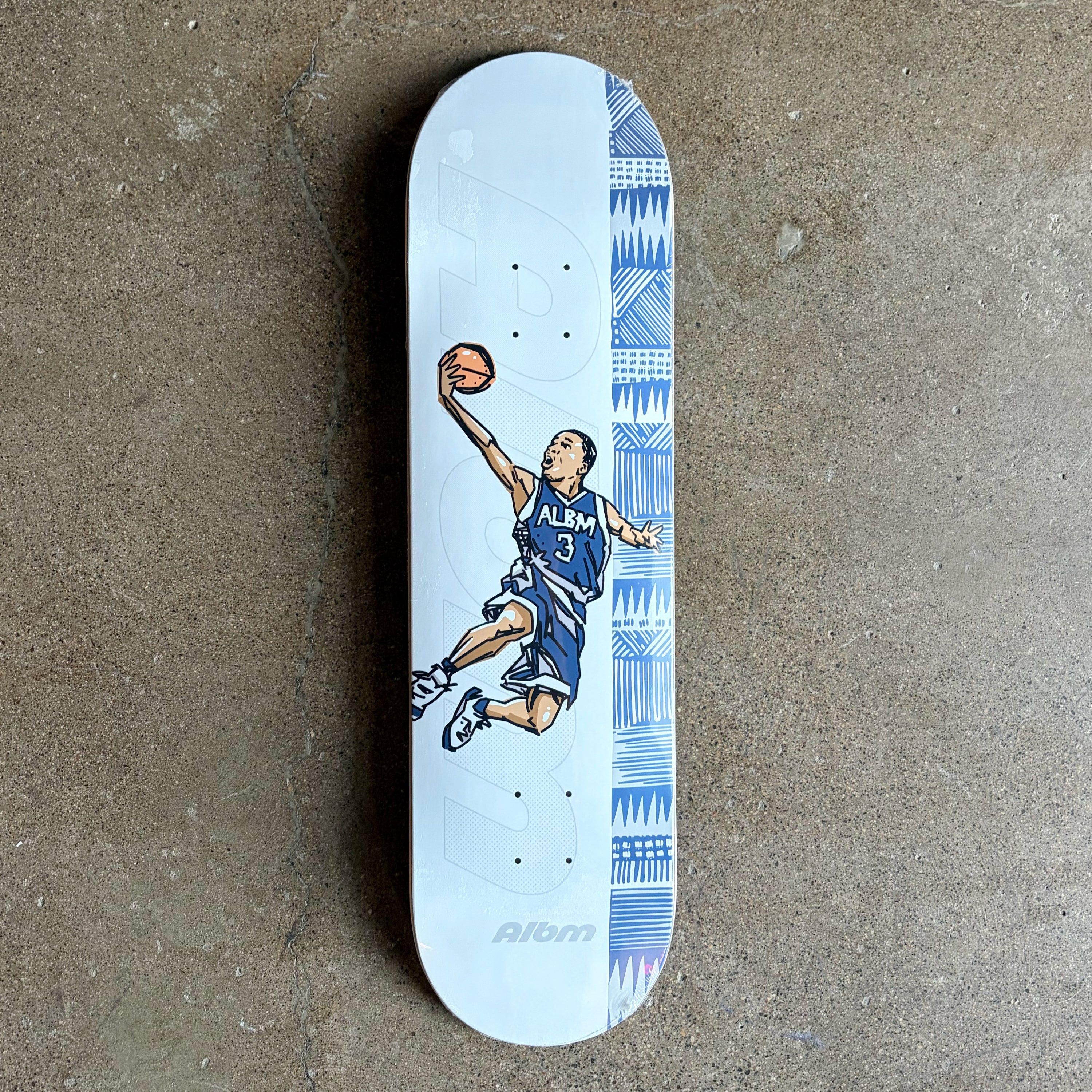 Full image of Album Skateboards deck with cartoon art of a basketball player doing a slam dunk