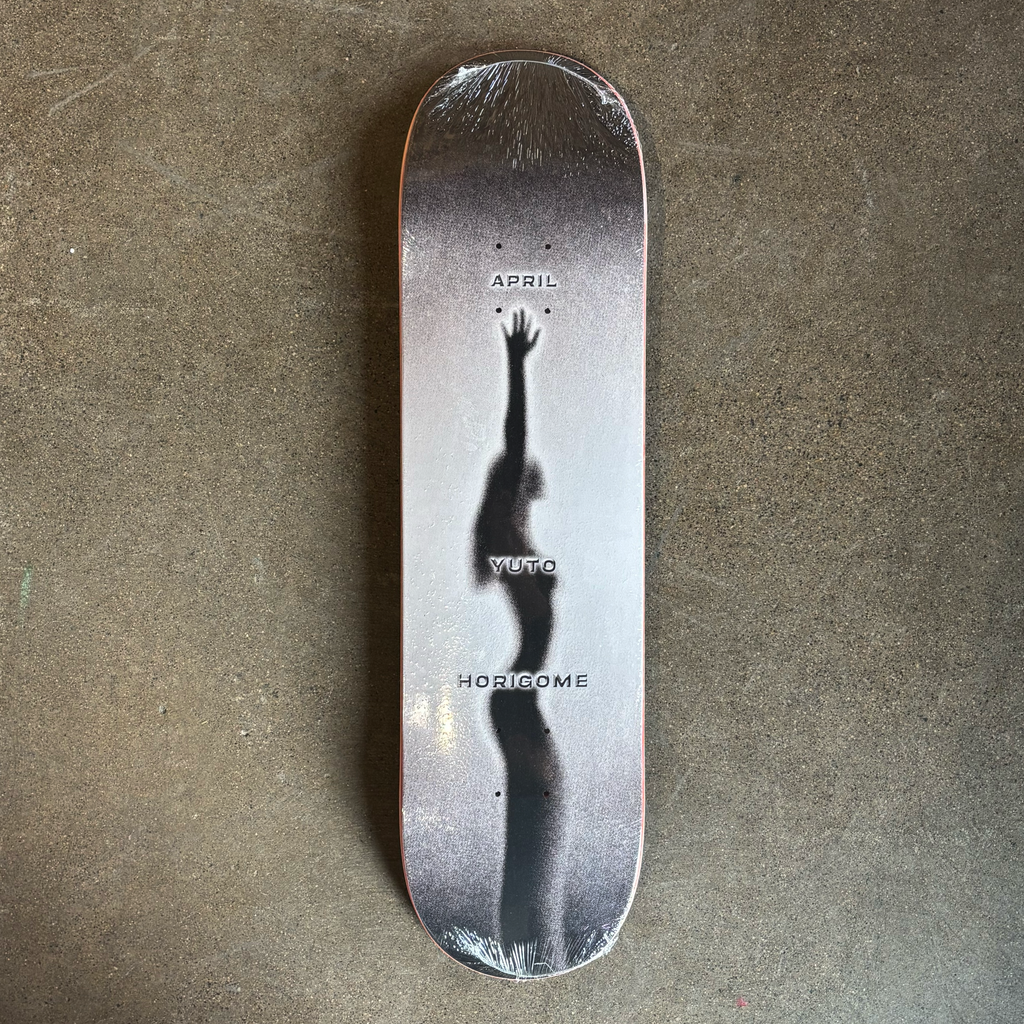 Full image of deck.
Shadow of a girl stretching. April and Yuto stamped font throughout board