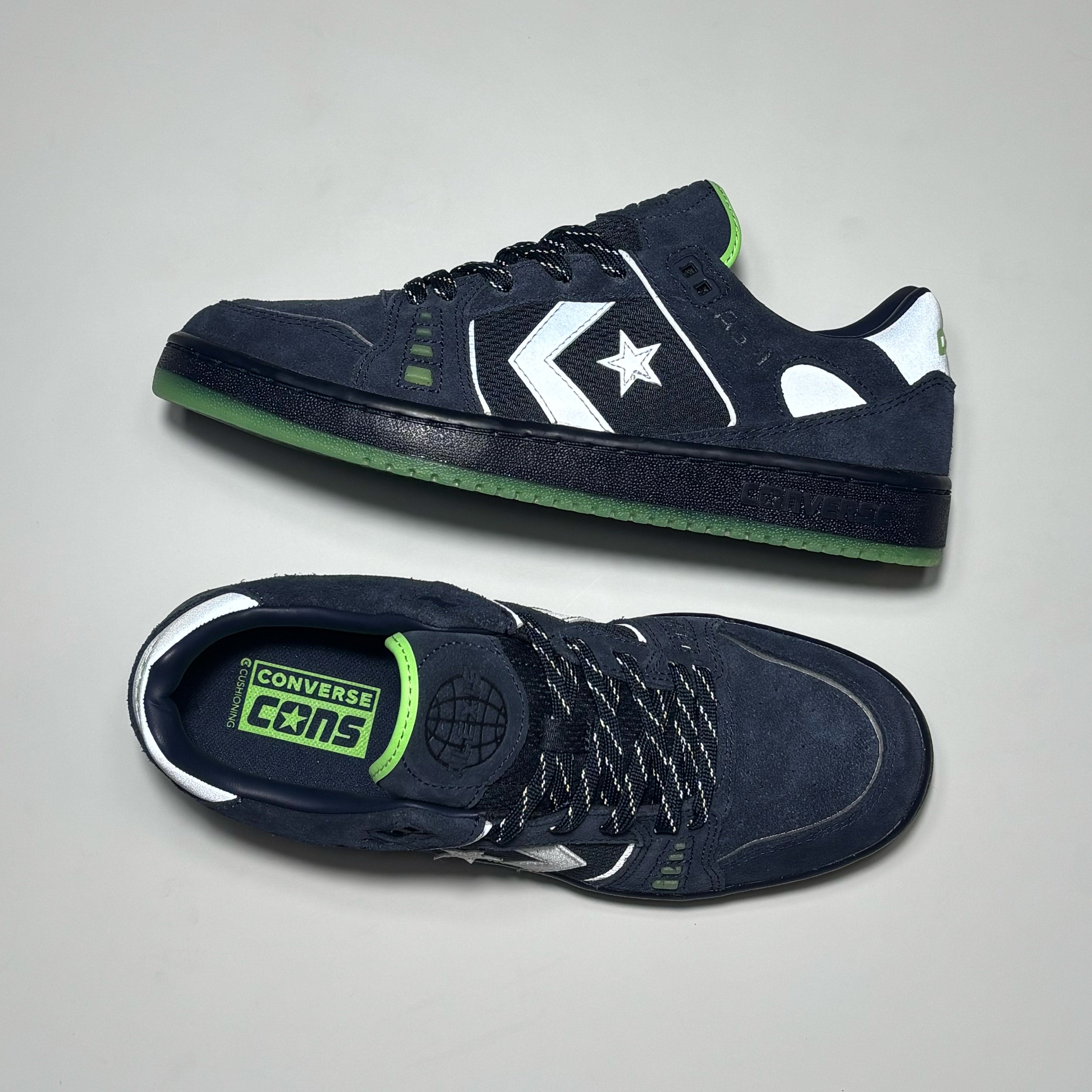 Close detail of 3M reflective branding and embossed AS-1 Converse logo on tongue. 