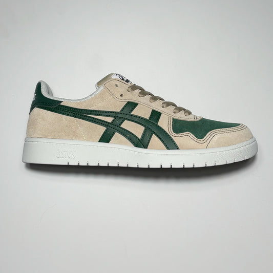 Image of right shoe. 
Light tan suede with green branding.