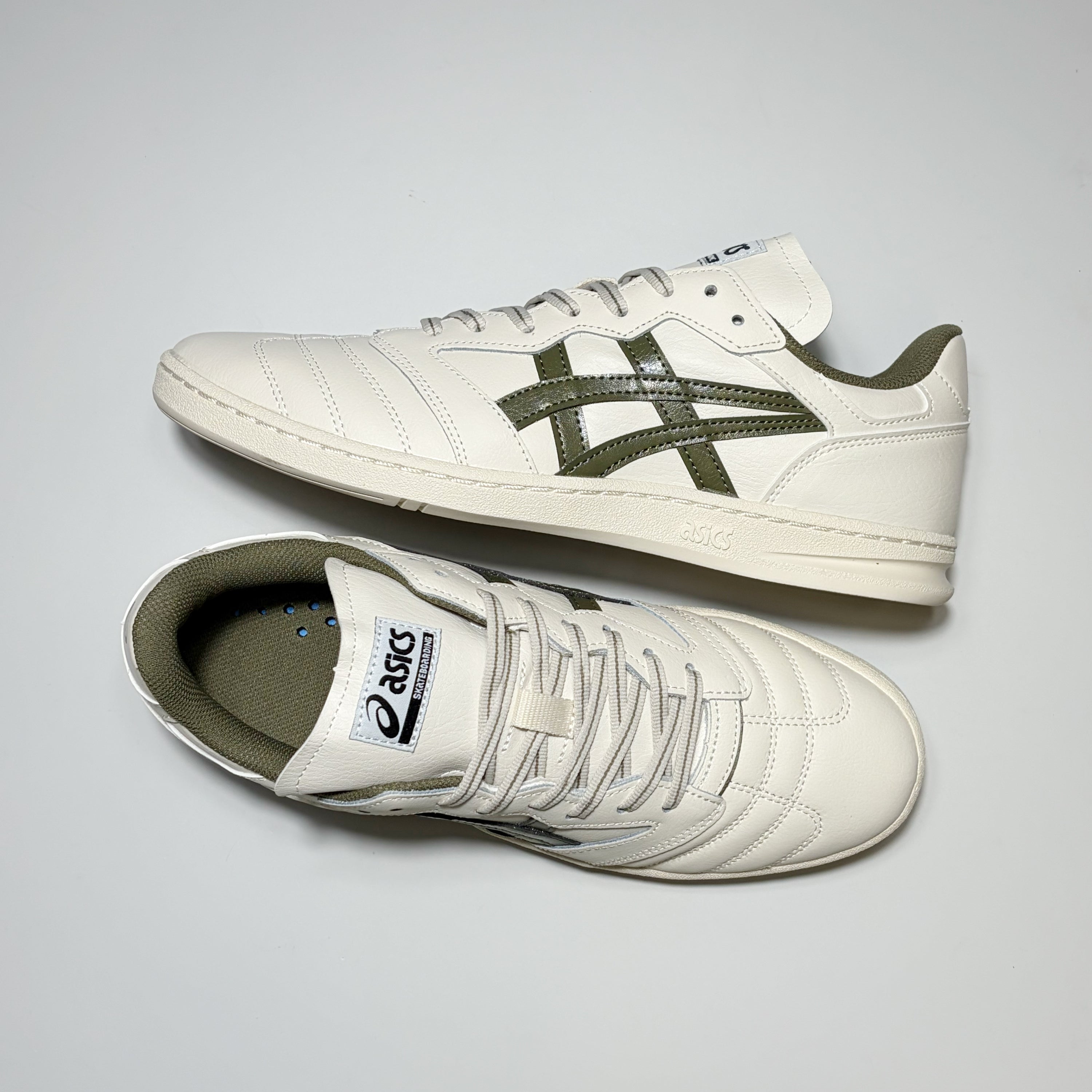 Pair of Asics Leggerezza shoes on white background.
