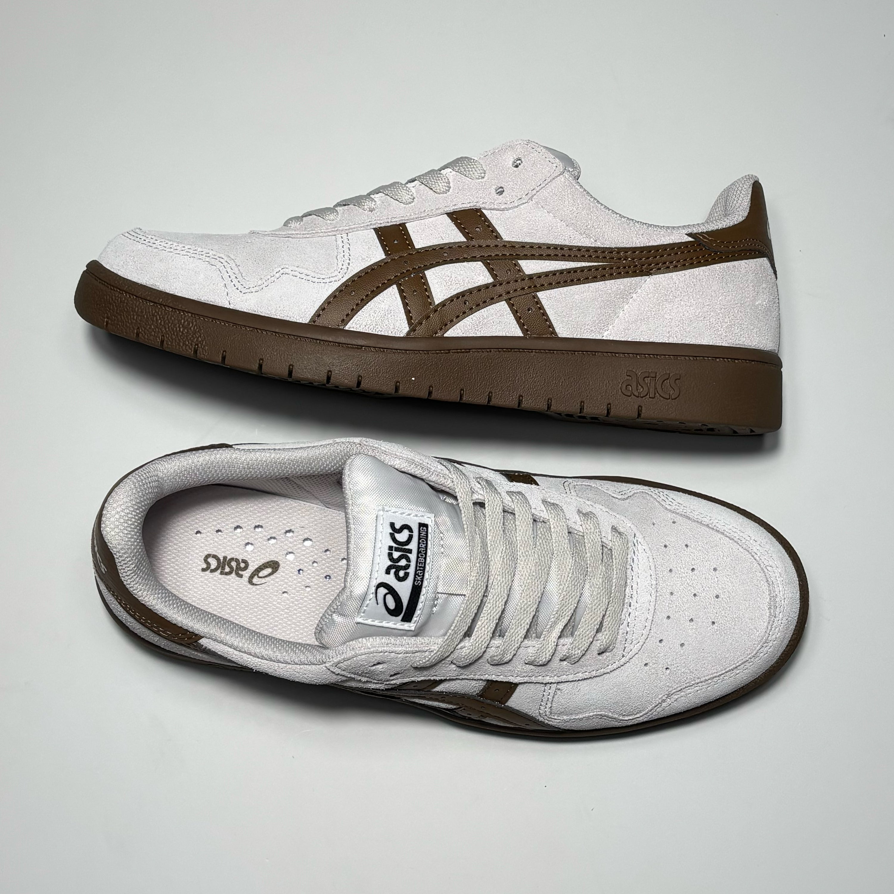 Toe down view with side profile. 
Asics label on tongue.