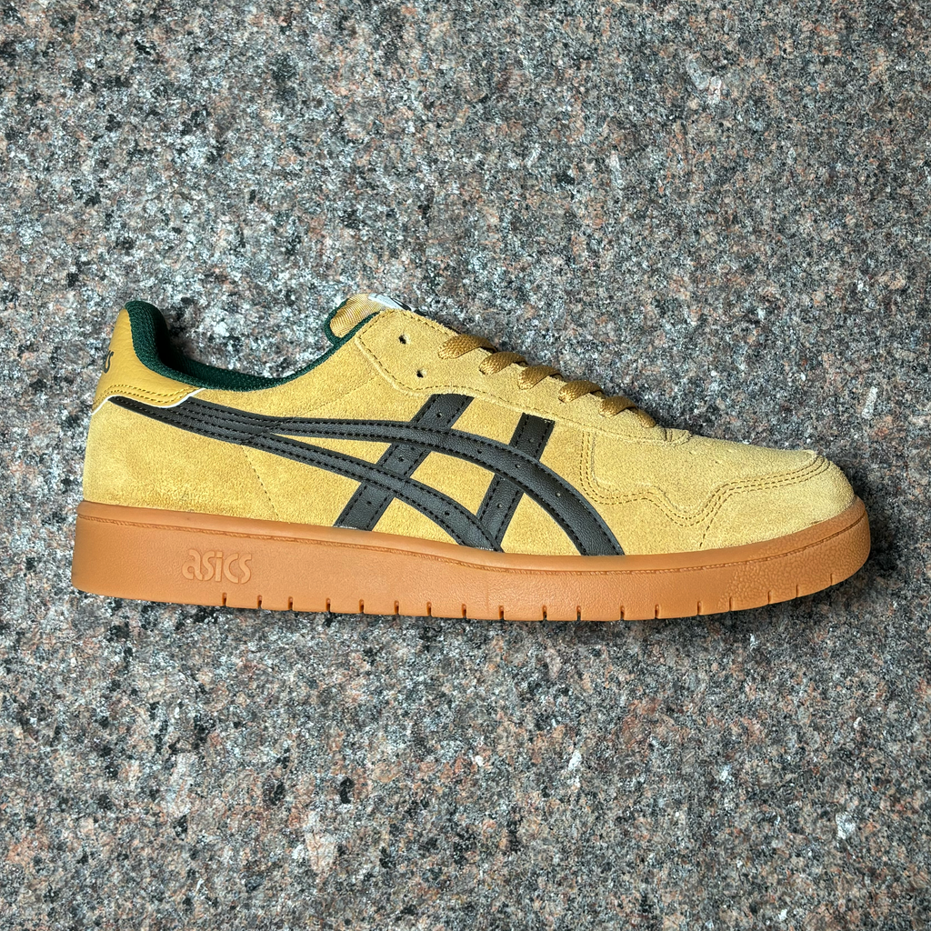 Side view of right shoe. Wood color suede with black asics logo and gum outsole