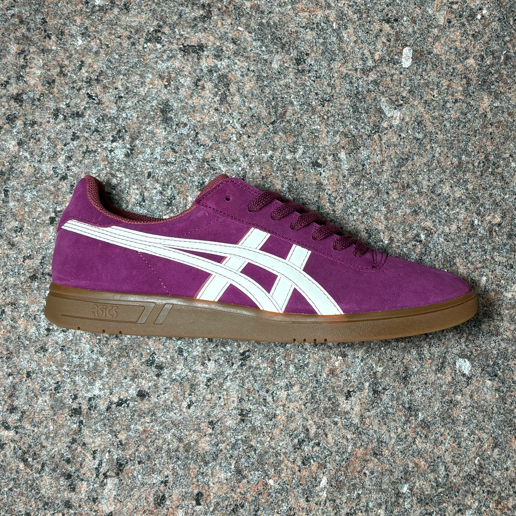 Side view of right shoe. Violet suede with white asics branding and gum outsole