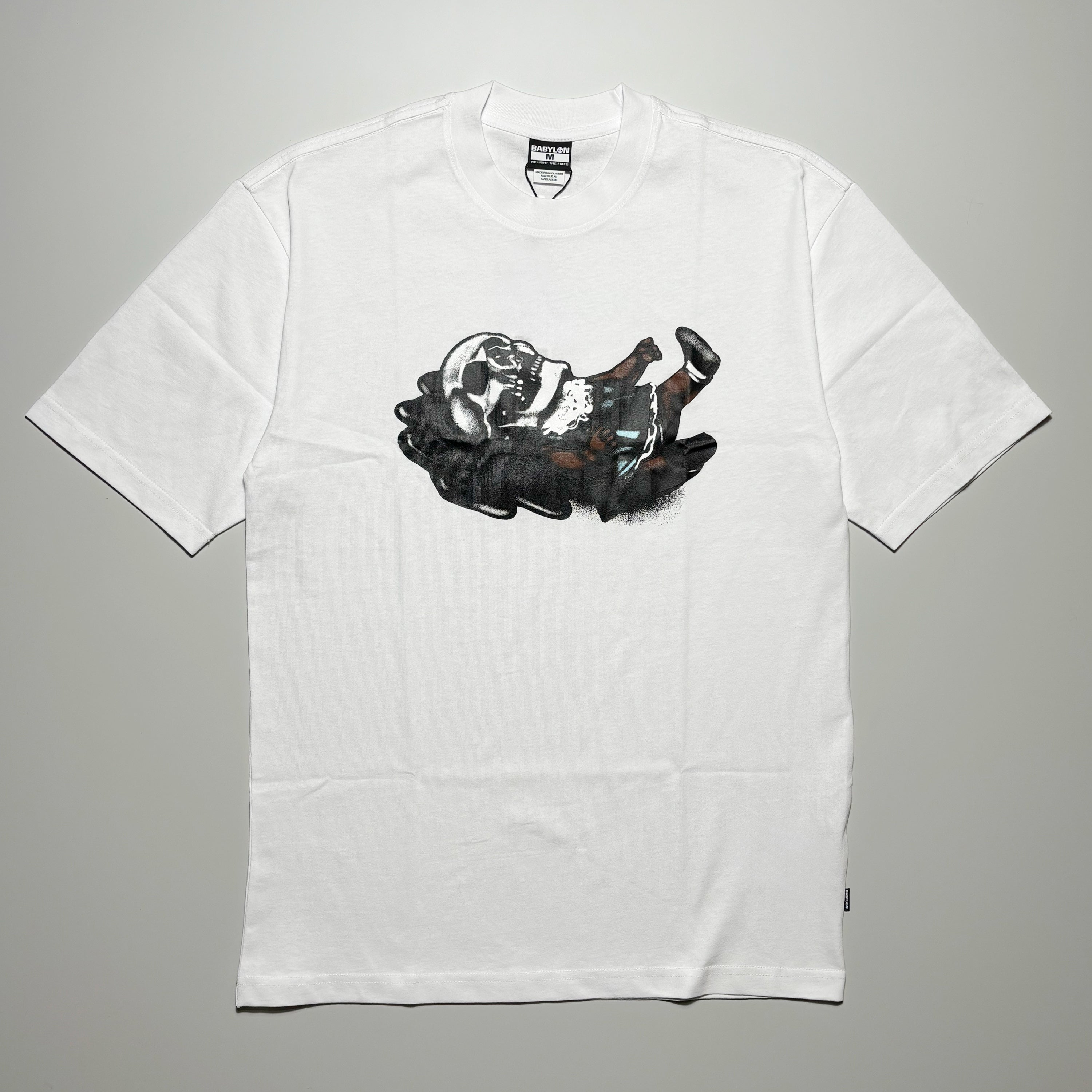 Front image of white tee with art on chest.