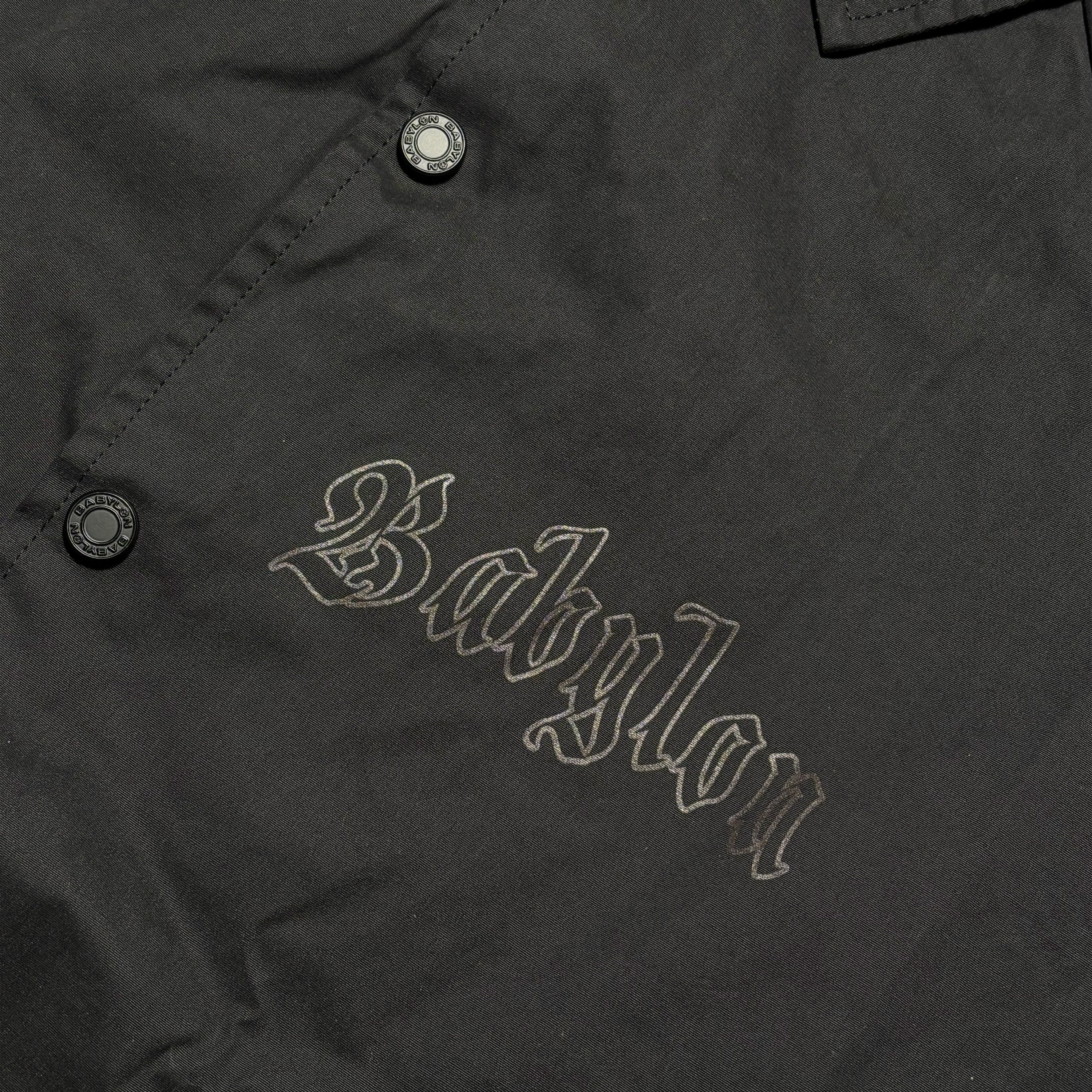 Close detail of babylon printed on chest