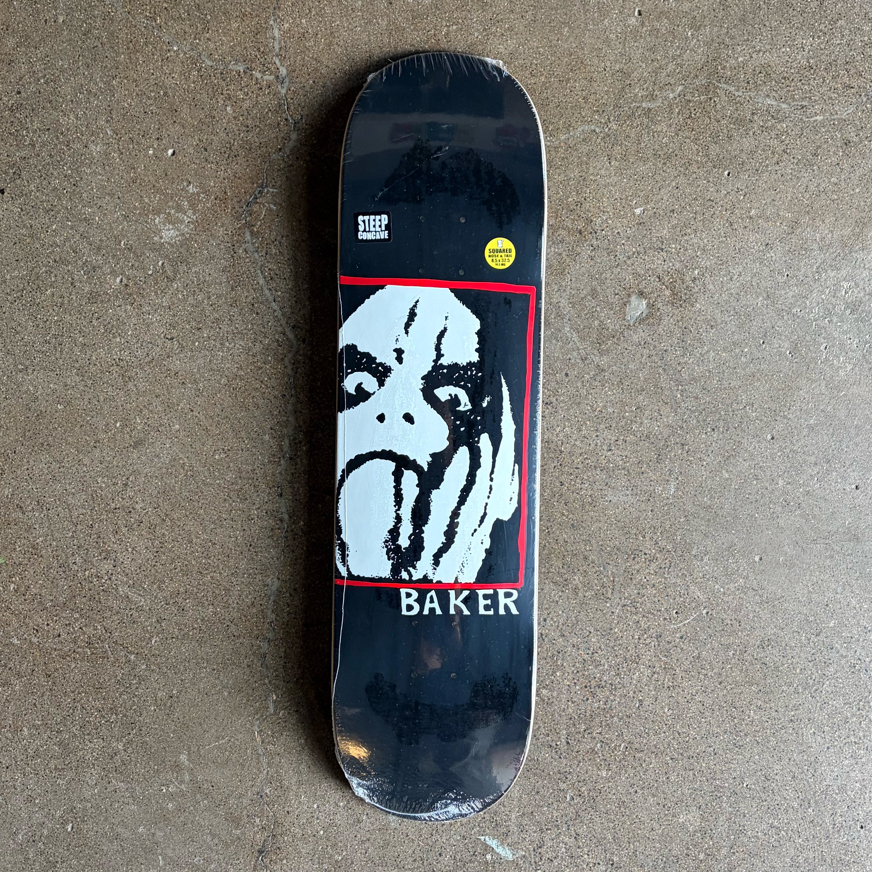 Full image of deck, evil face in white on black background of skateboard.