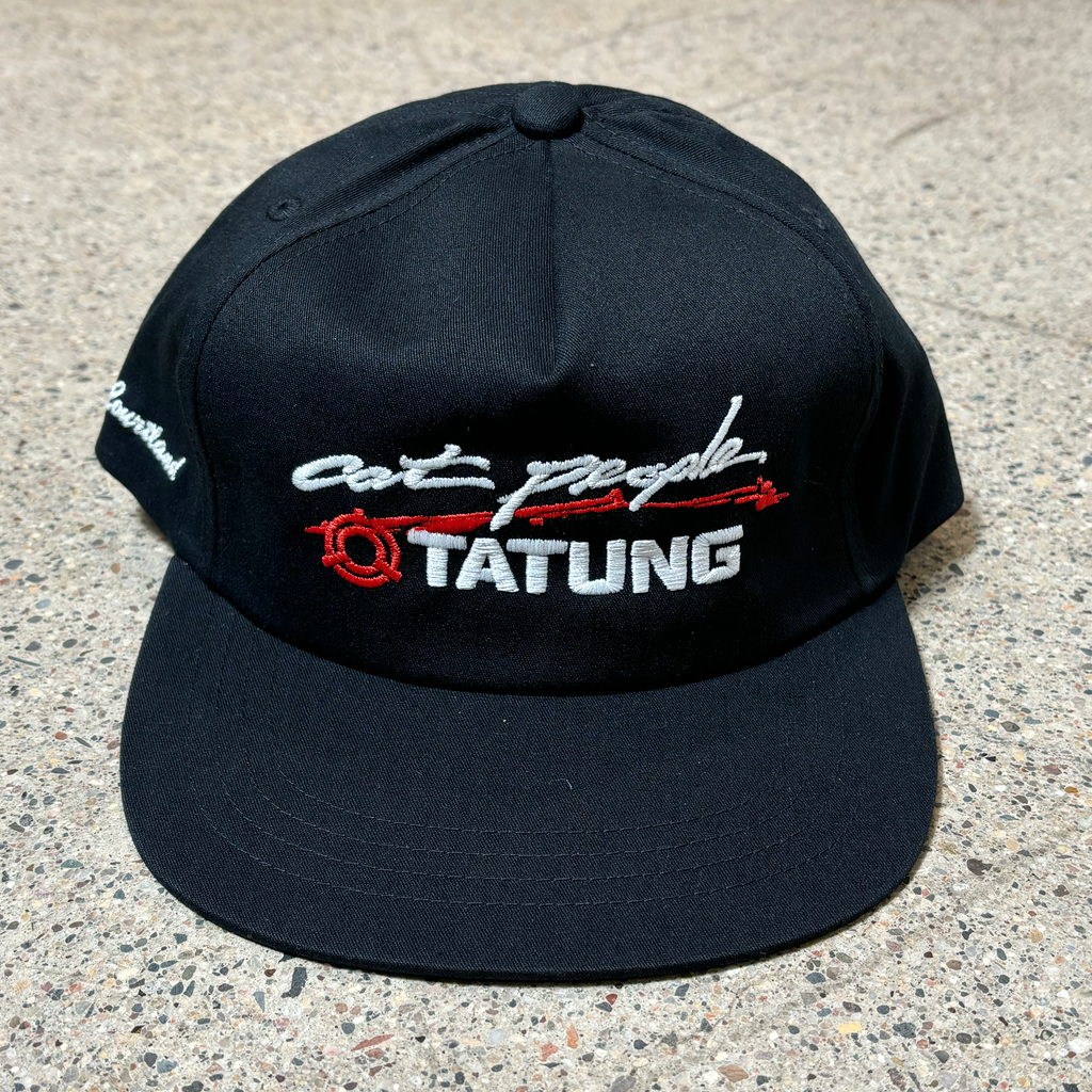 Front image of black hat. Embroidered font on crown and side.