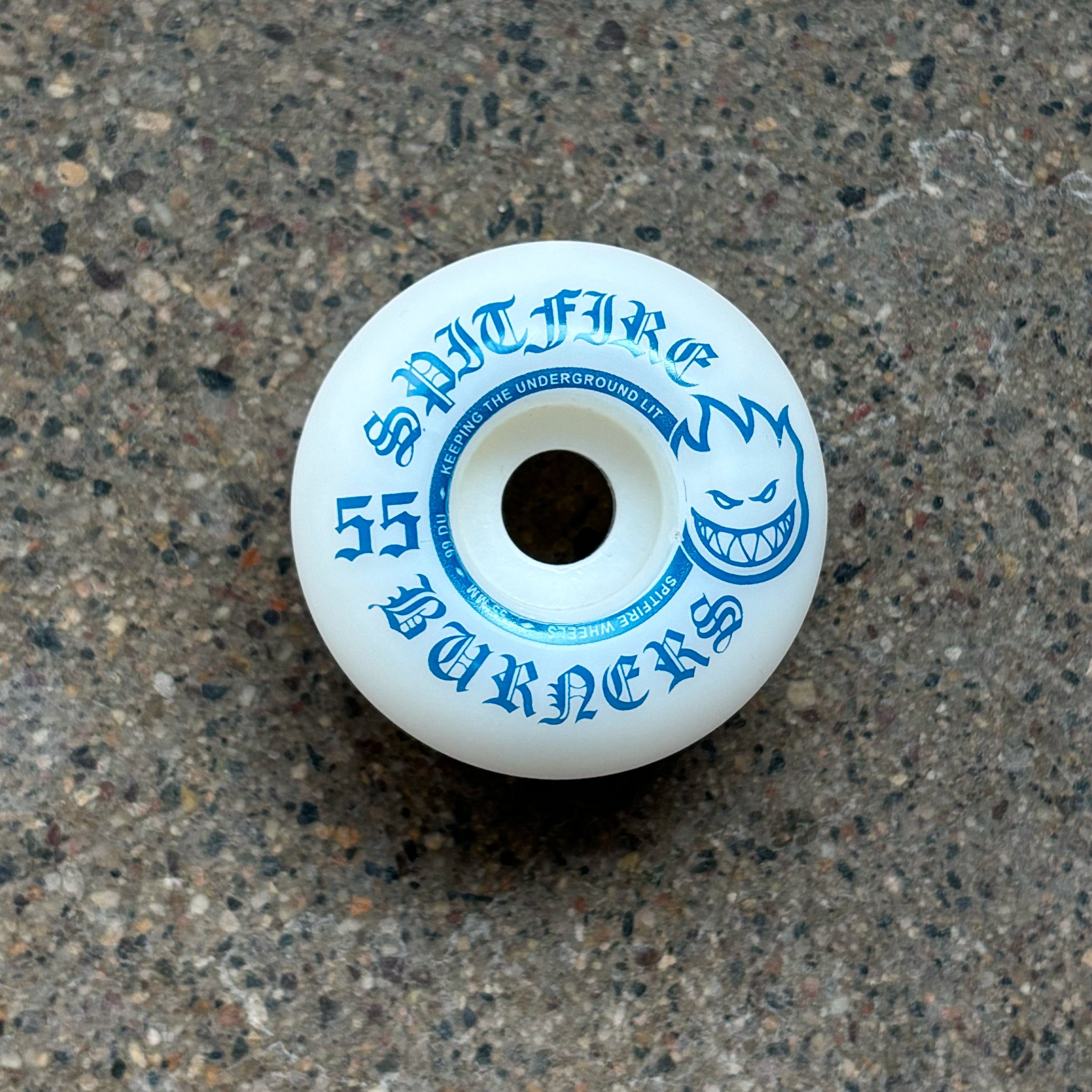 Image of white wheel with blue artwork