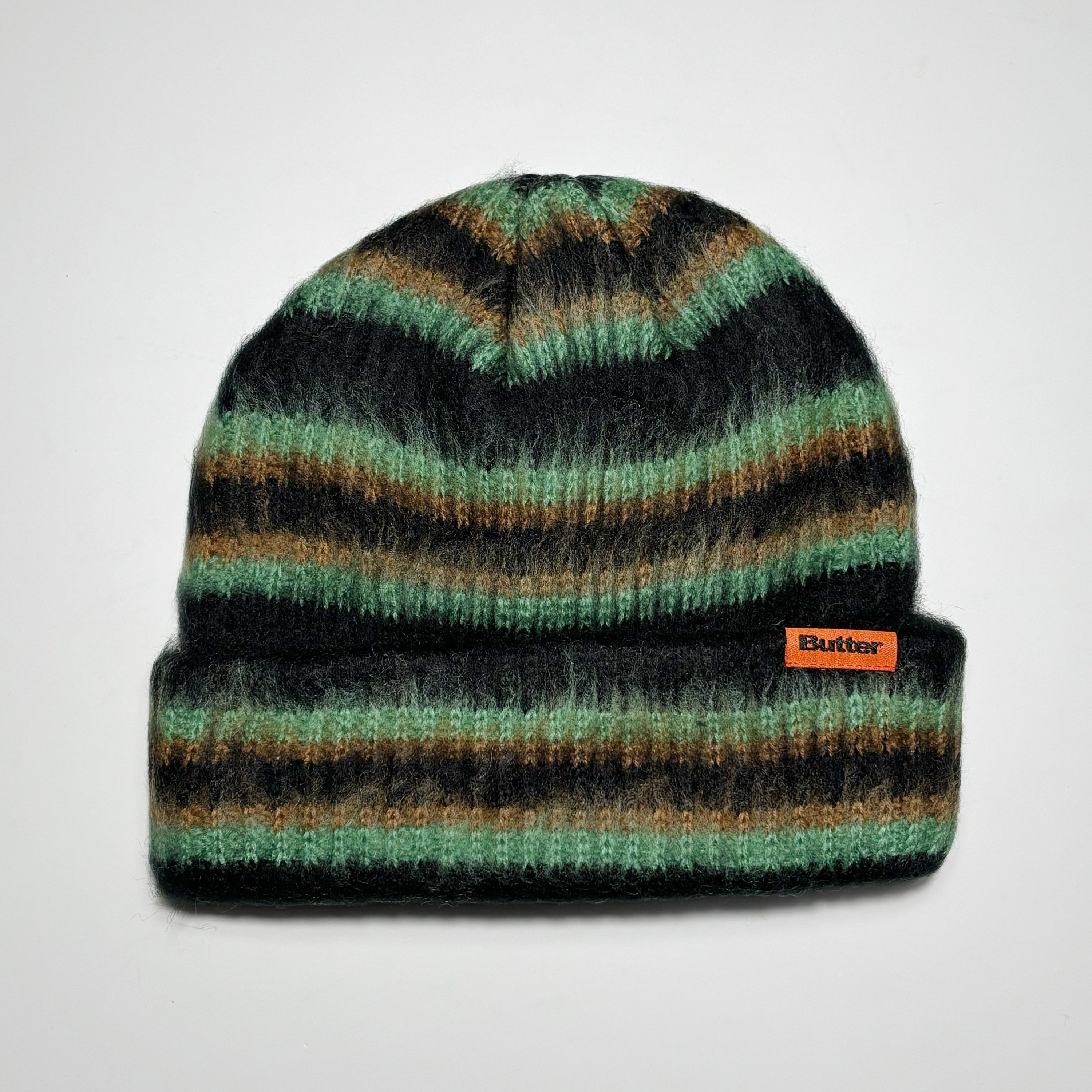 Striped beanie with woven label on fold.