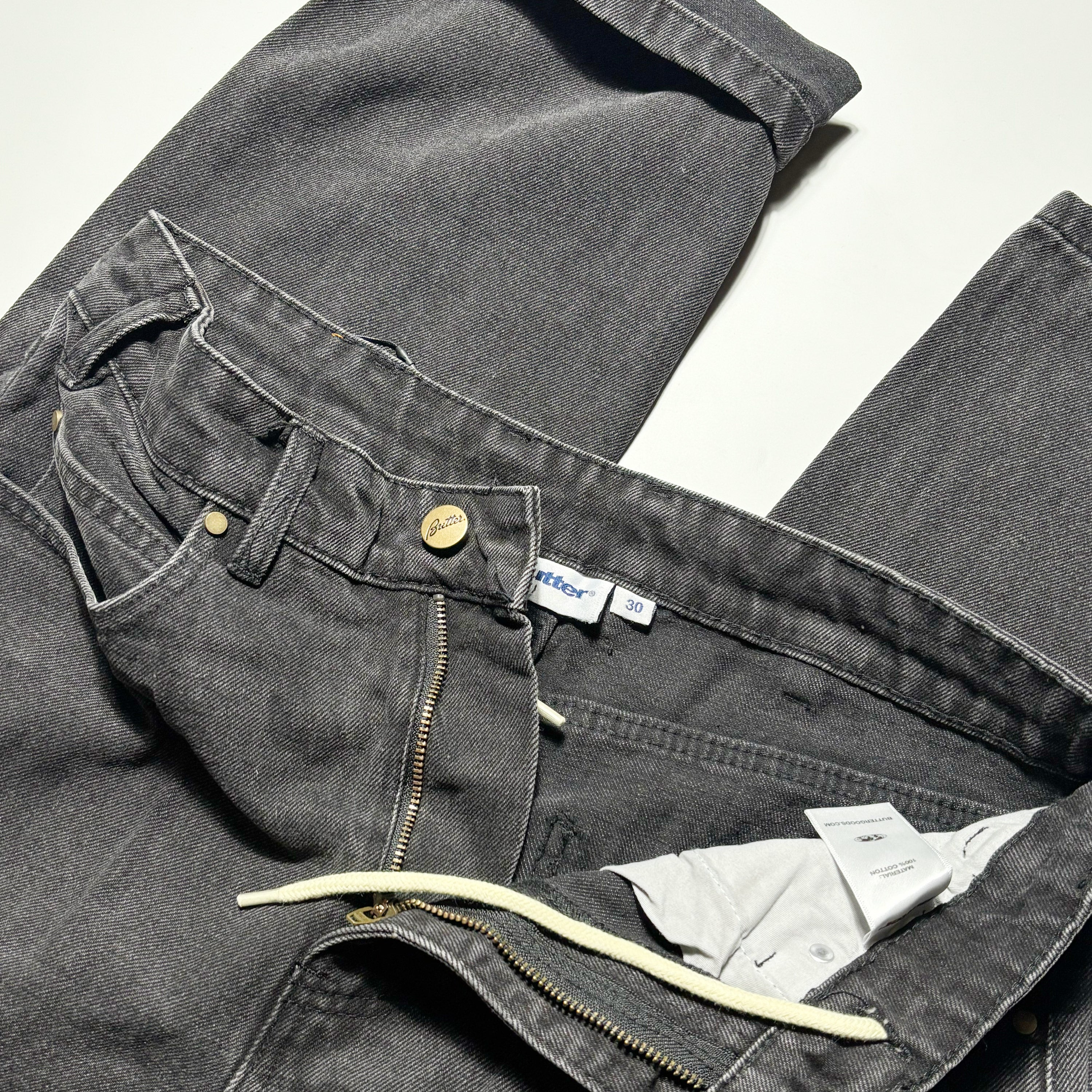 Close detail of front of denim. zipper with internal drawstrings.