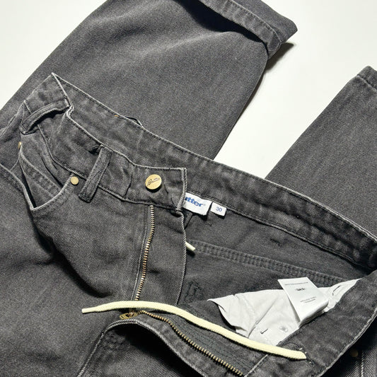 Close detail of front of denim. zipper with internal drawstrings.