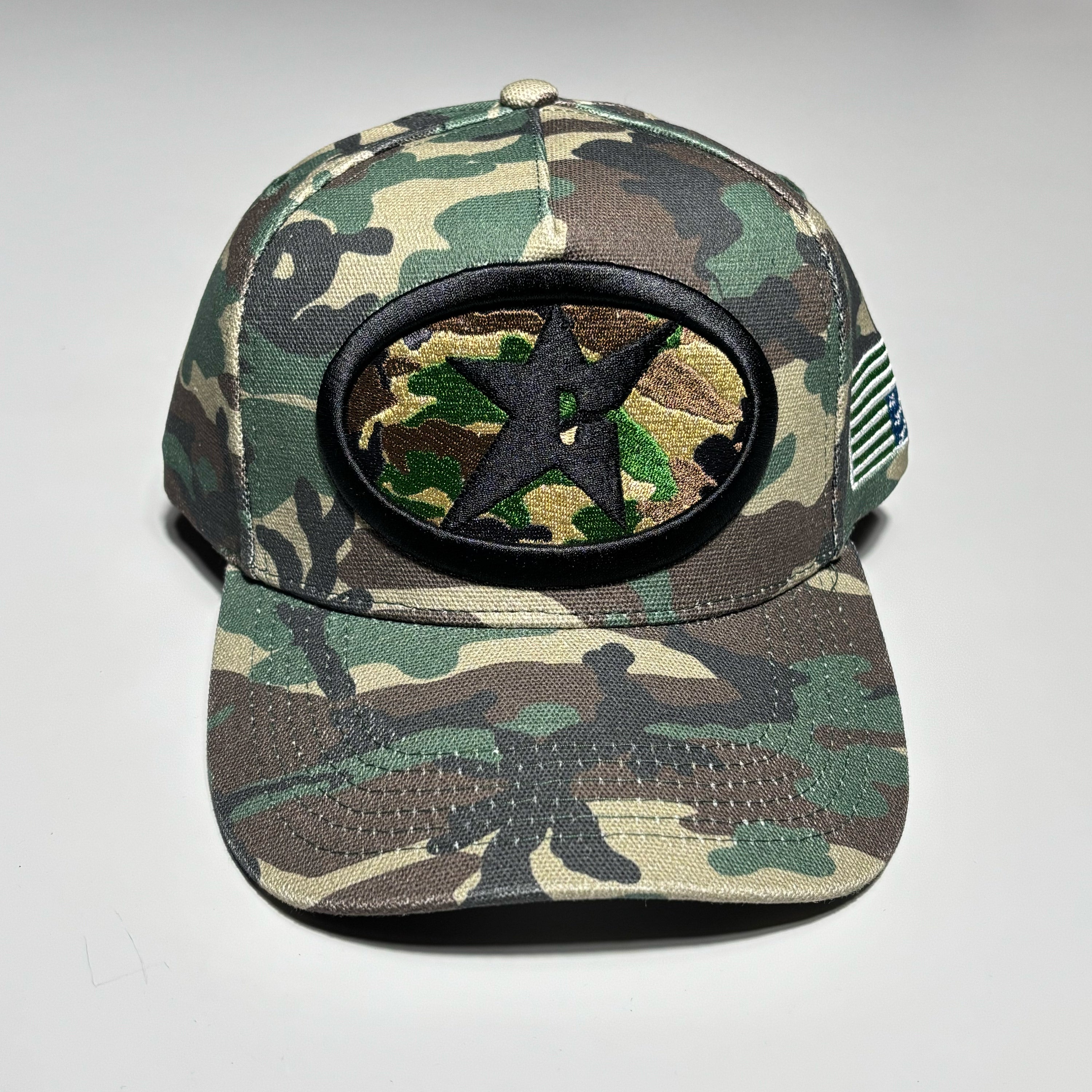 Camo hat with c-star patch on crown.