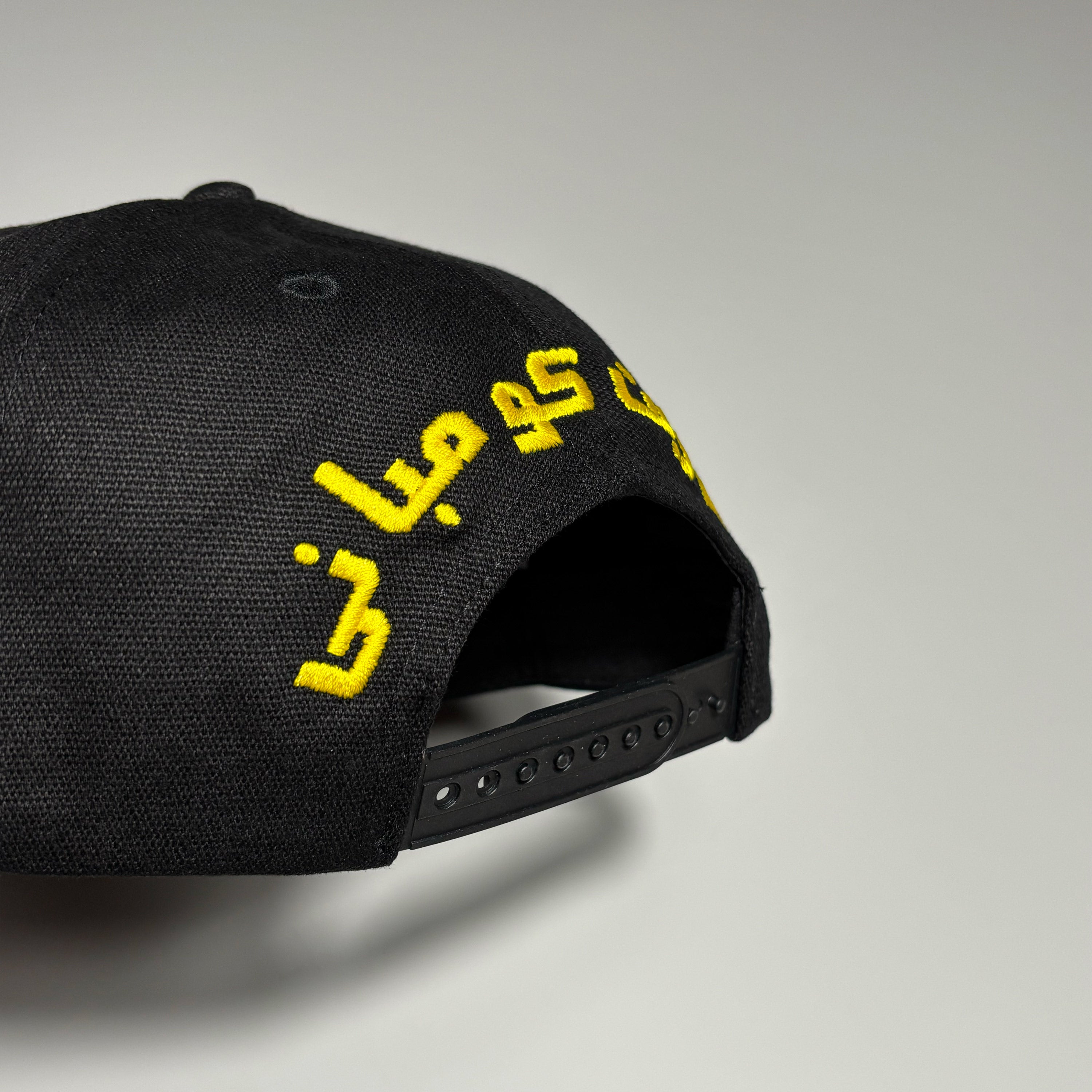 Embroidered font over back closure.