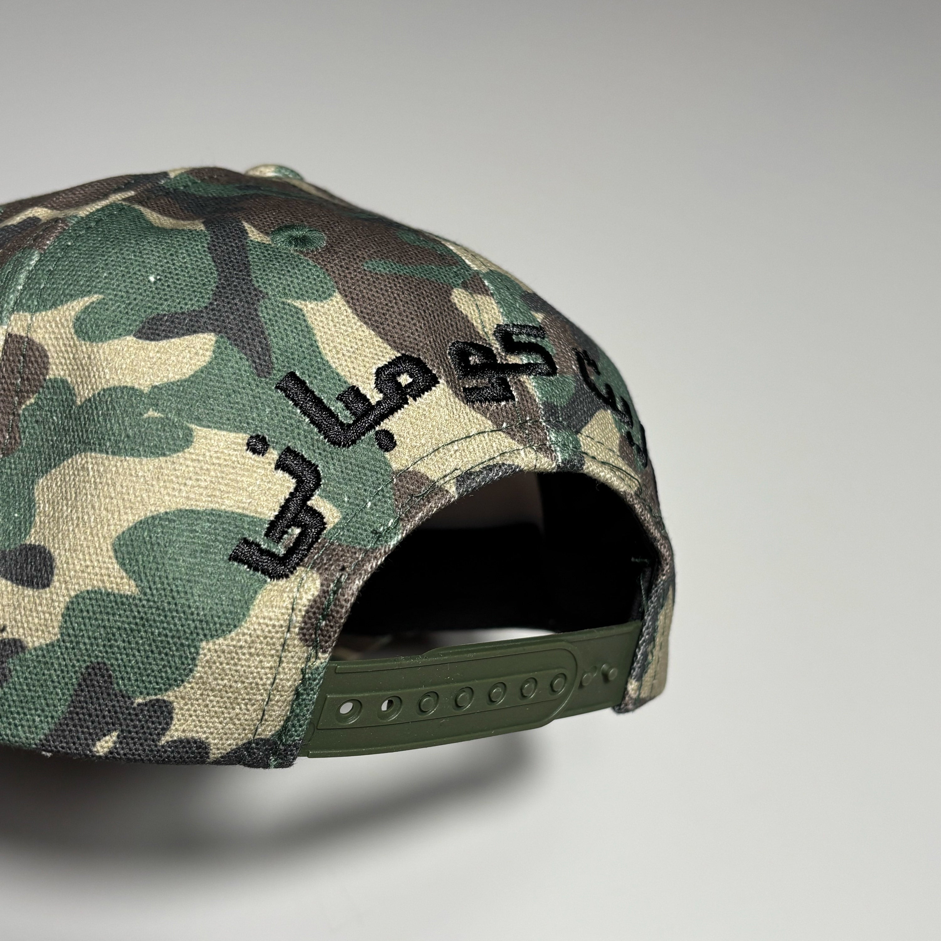 Embroidered font over back closure.