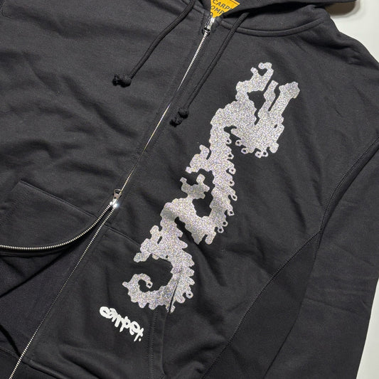 Close detail of silver printed dragon