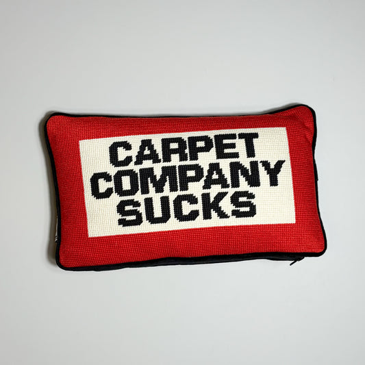 Carpet company season 22 needle point pillow. Red/white with black text "carpet company sucks" 
