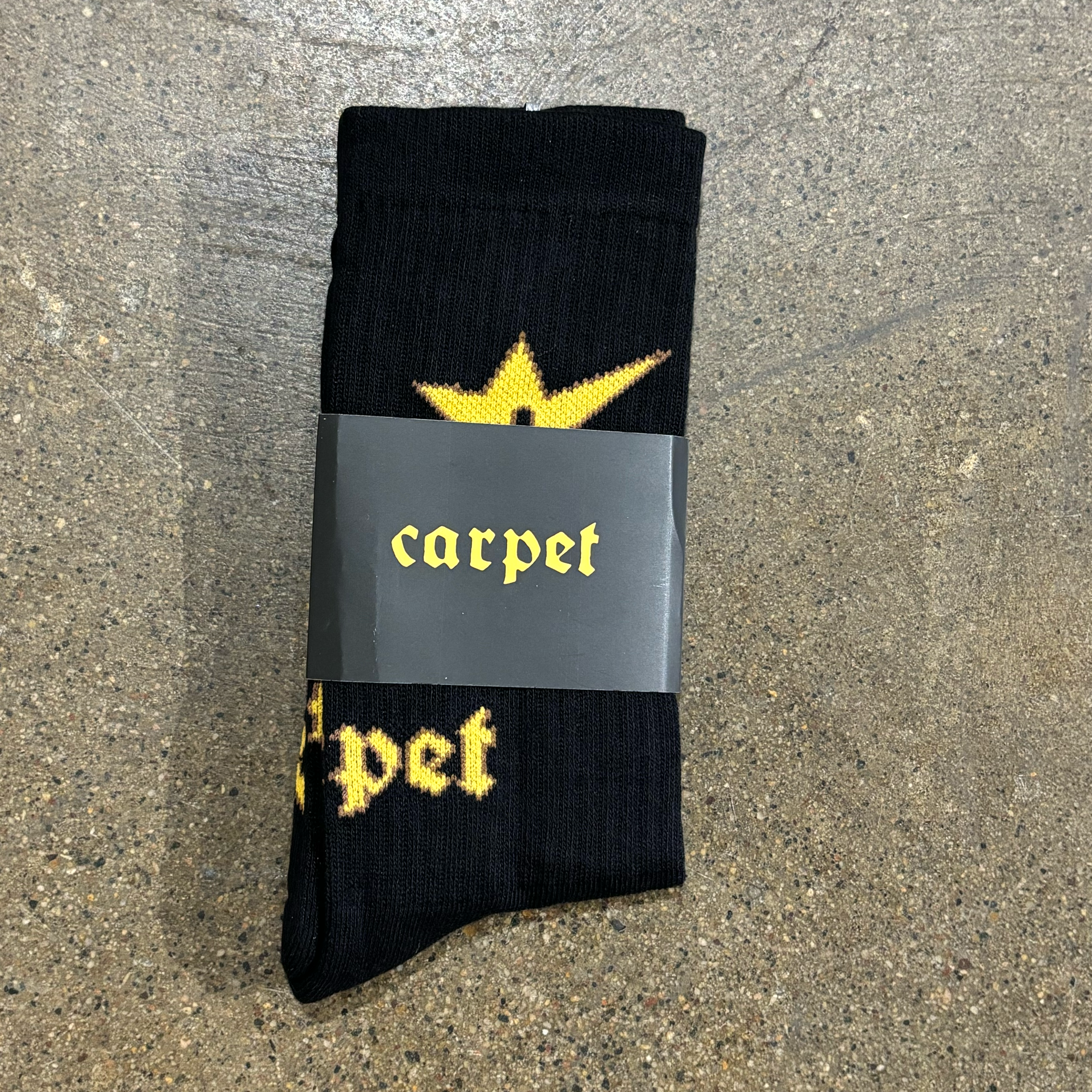 YELLOW C-STAR AND CARPET FONT WOVEN ON BLACK SOCK
ONE SIZE FITS MOST 