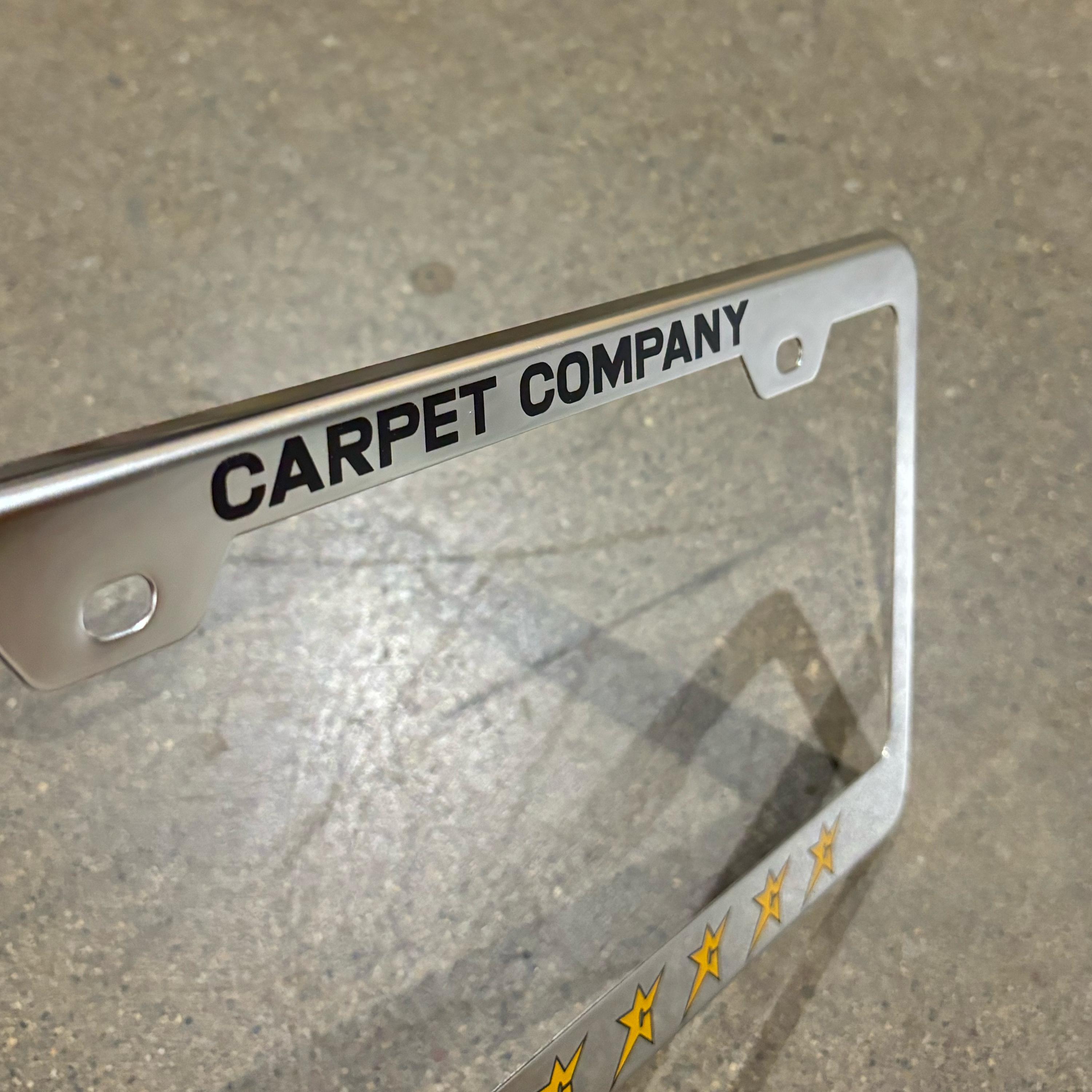 DETAIL IMAGE OF THE CARPET COMPANY FONT AND C-STAR LOGOS