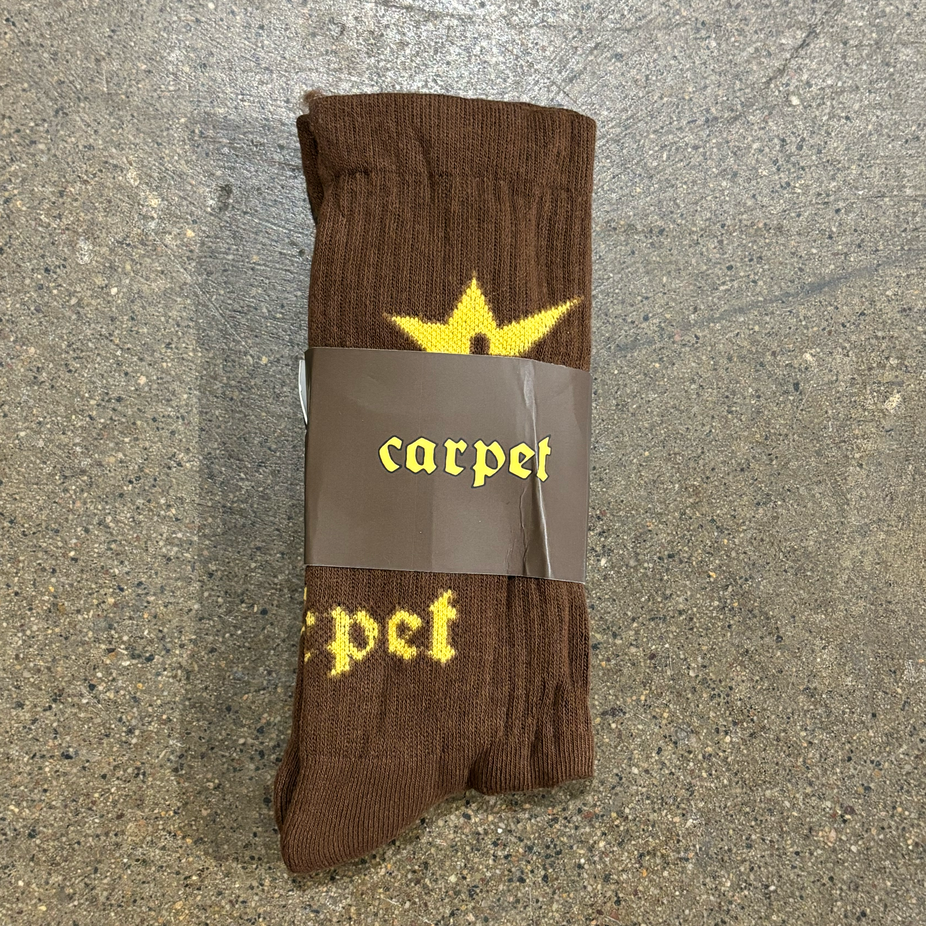 YELLOW C-STAR AND CARPET FONT WOVEN ON BROWN SOCK
ONE SIZE FITS MOST 