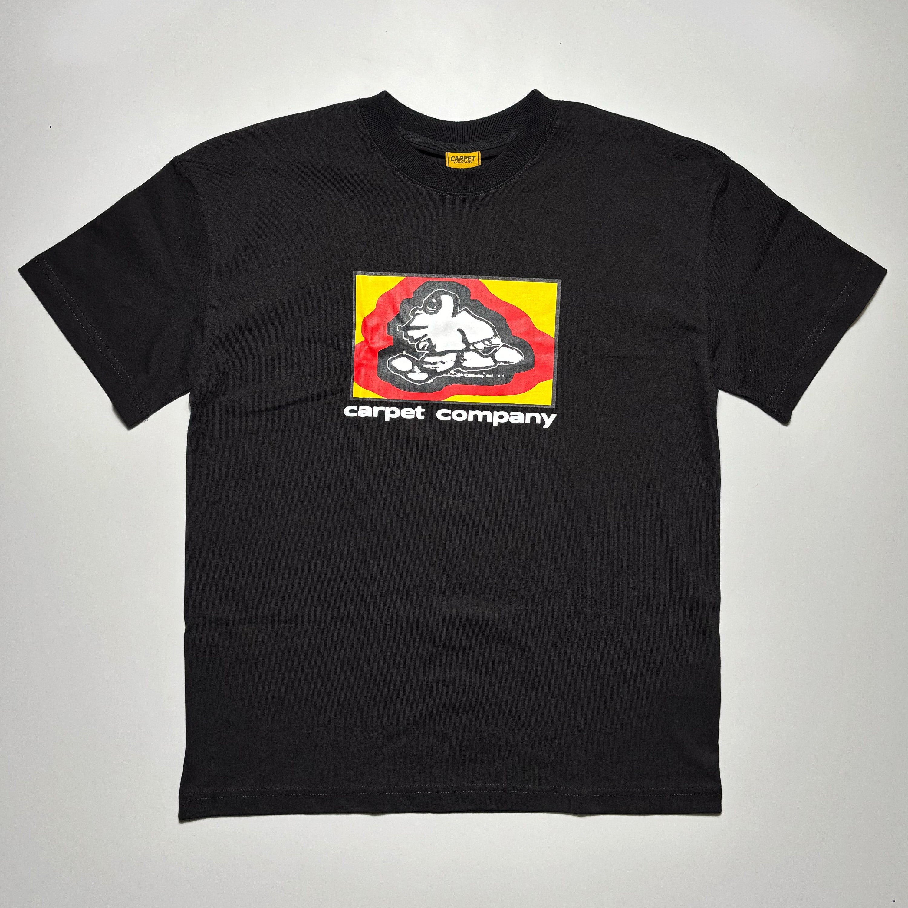 Front image of black tee with yellow/red printed art on chest.