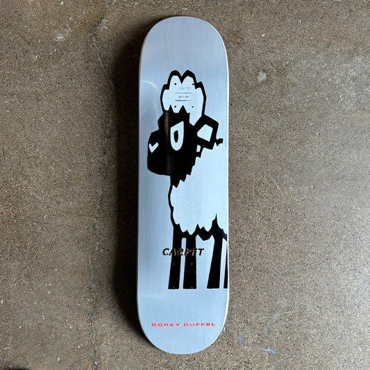 Full image of skateboard deck. Black sheep art work printed on grey background.