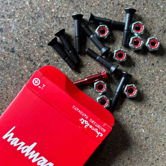 Image of black bolts with 1 red bolt.