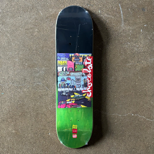 Full image of deck. Cartoon artwork in center. Green veneer on tail.