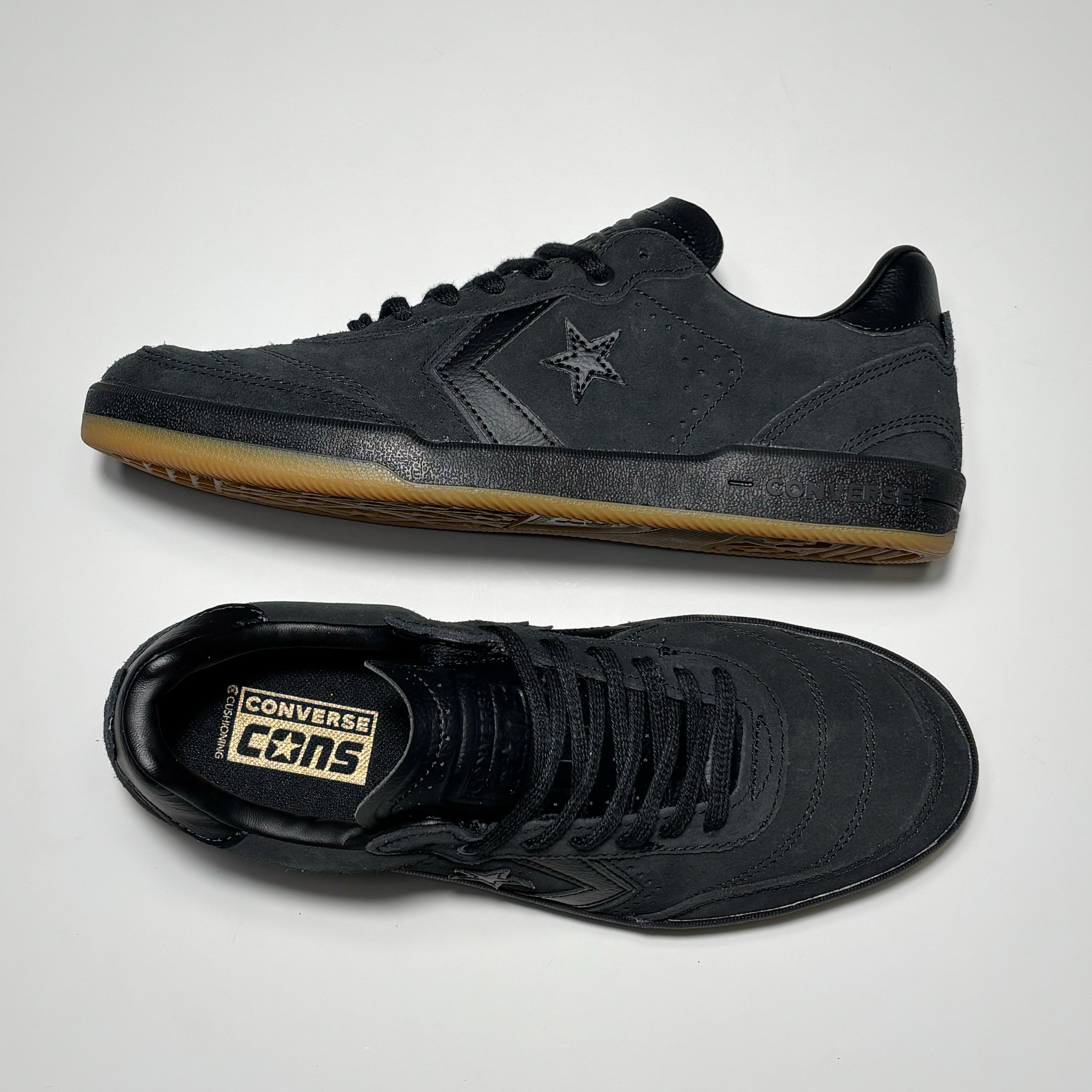 Toe down view with side profile.
Converse cons branding embossed on tongue.