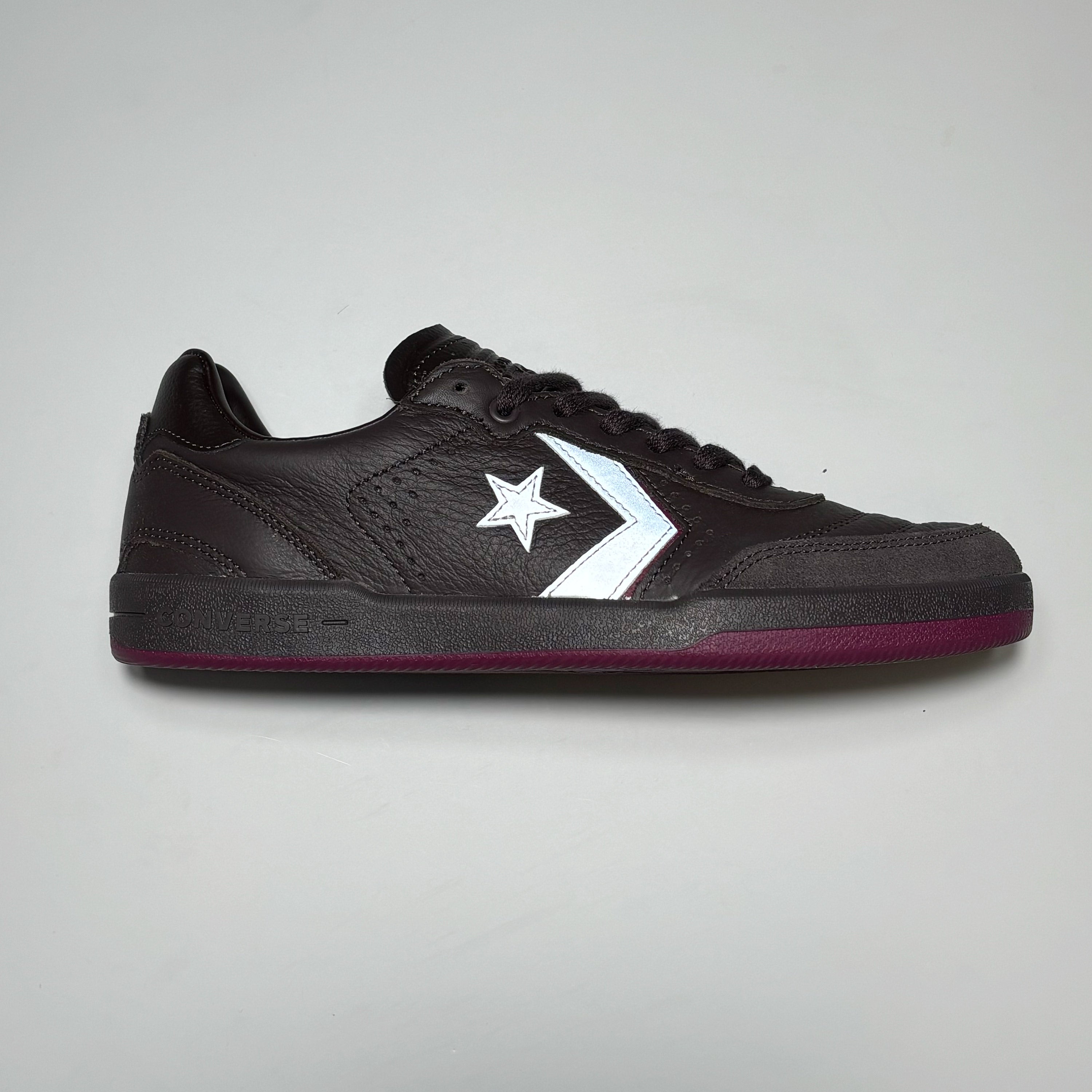 Side image of right shoe. Brown suede with 3M reflective chevron logo.