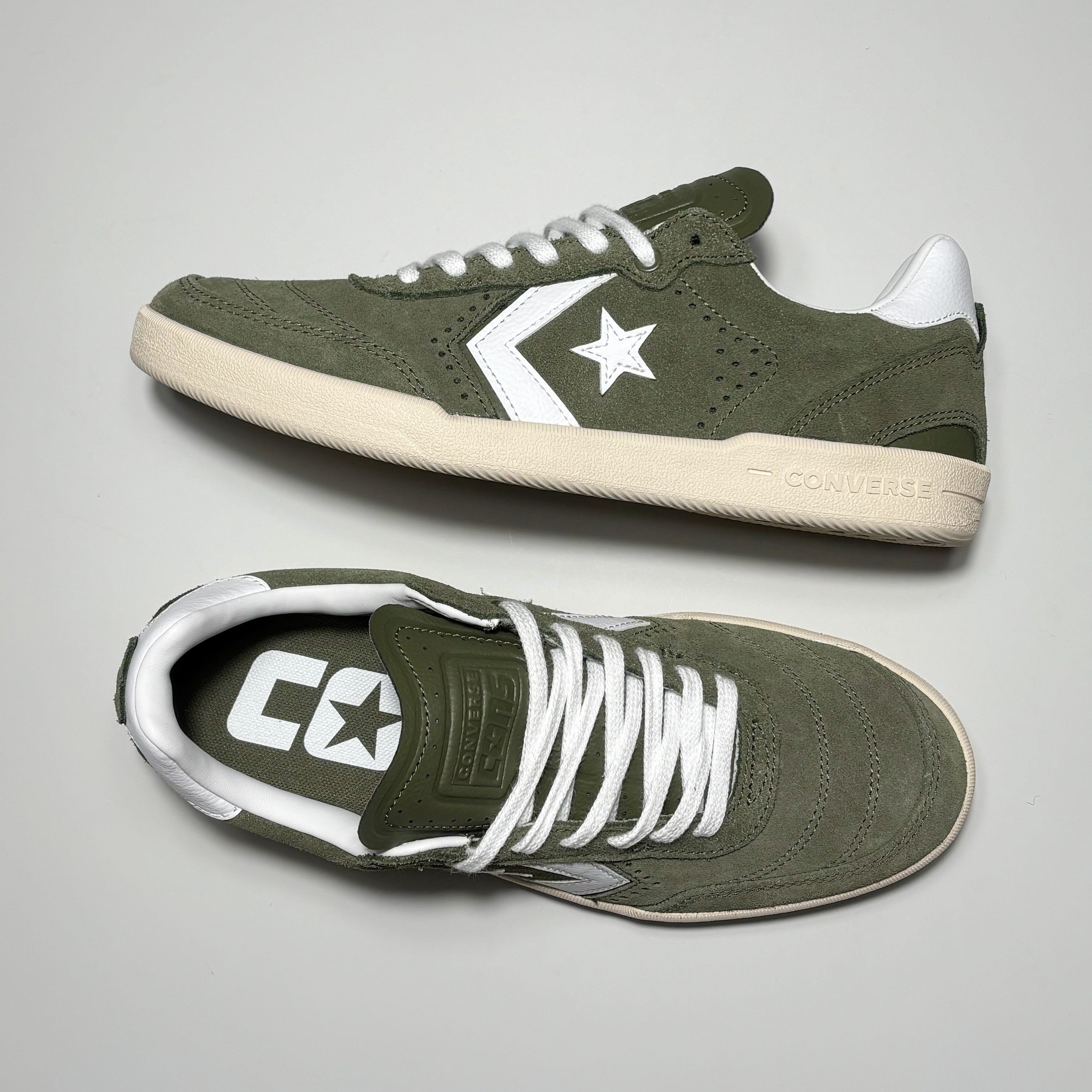 Toe down view with side profile.
CONS branding embossed on tongue.