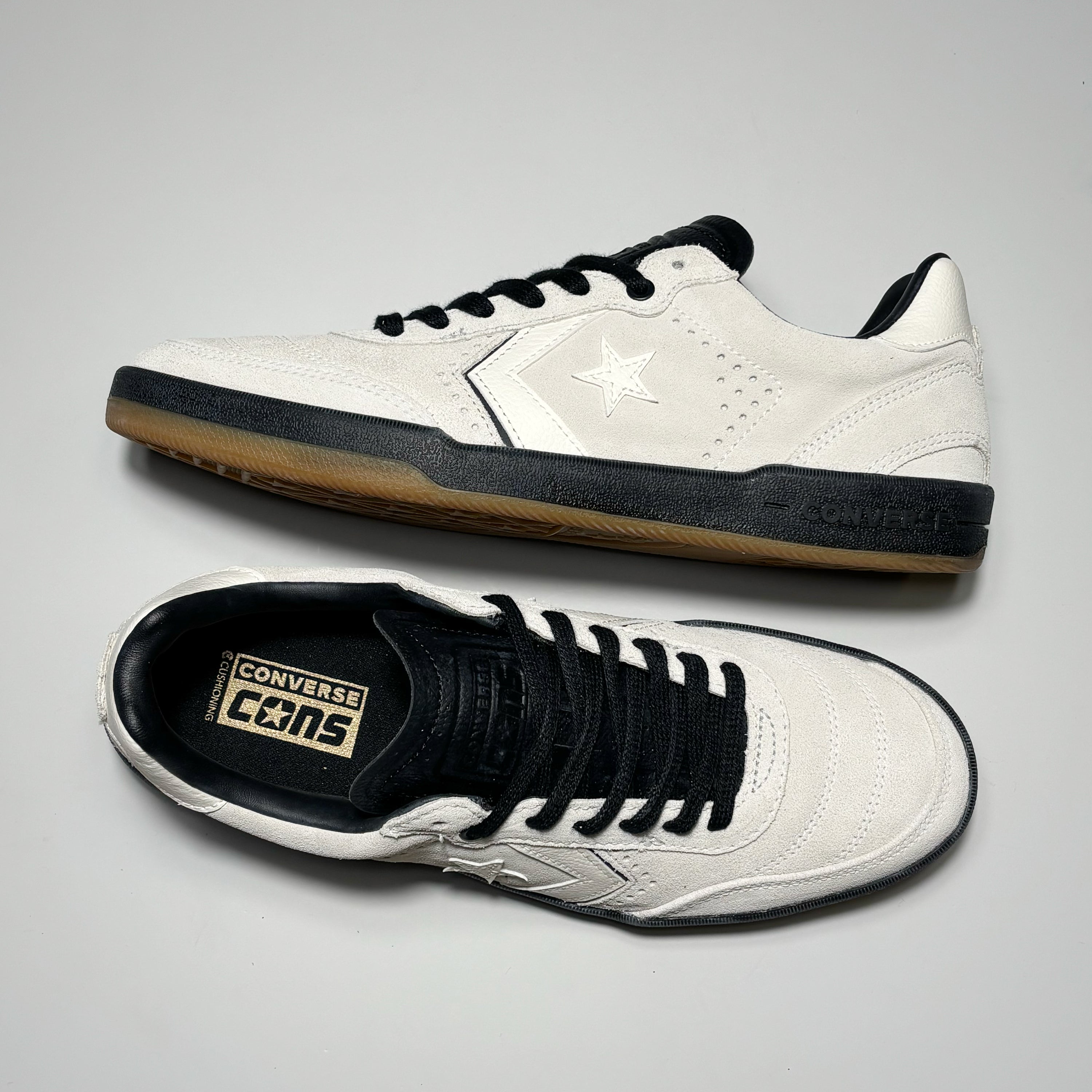 Toe down view with side profile.
Converse cons branding embossed on tongue.