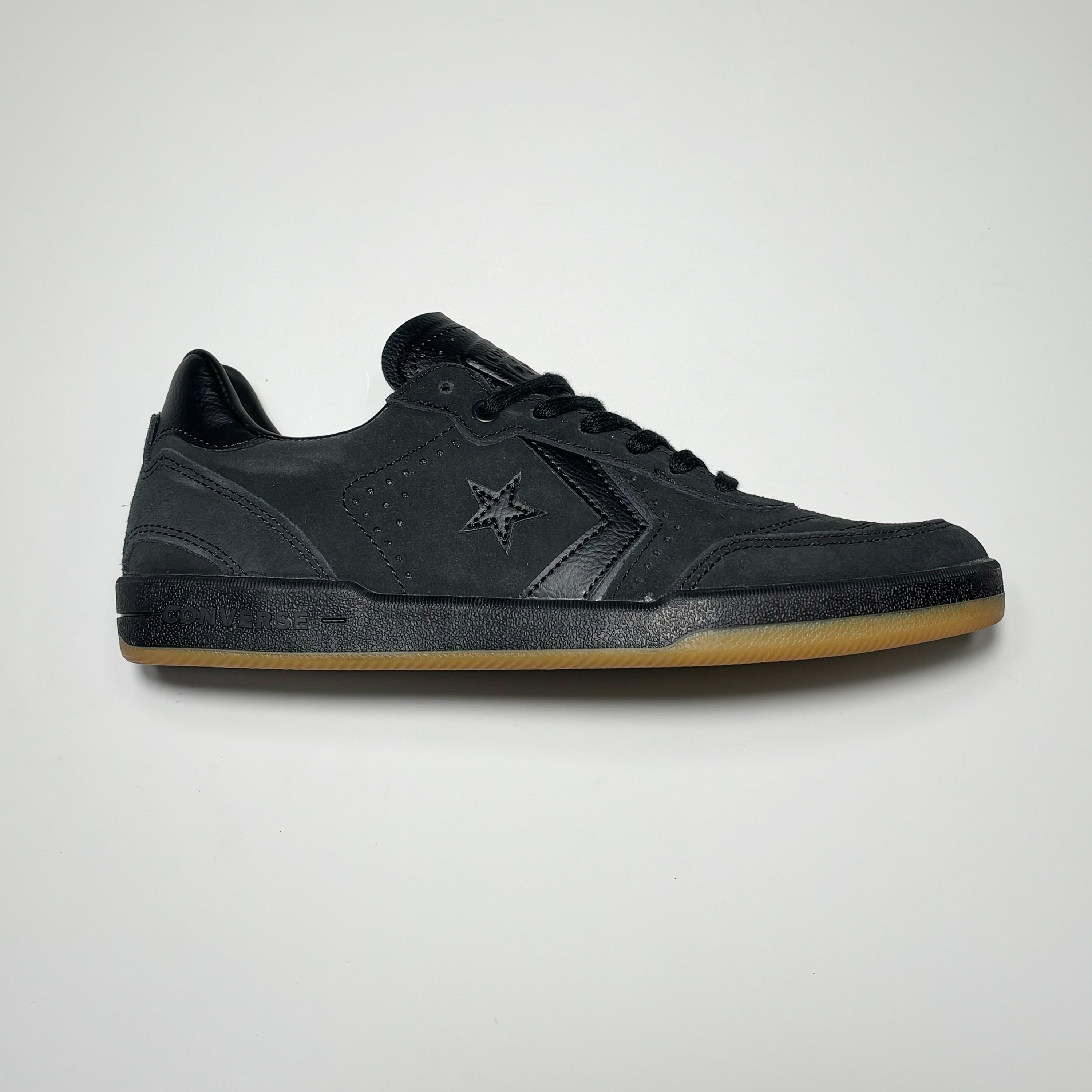 Side image of right shoe. Black suede with black mid-sole.